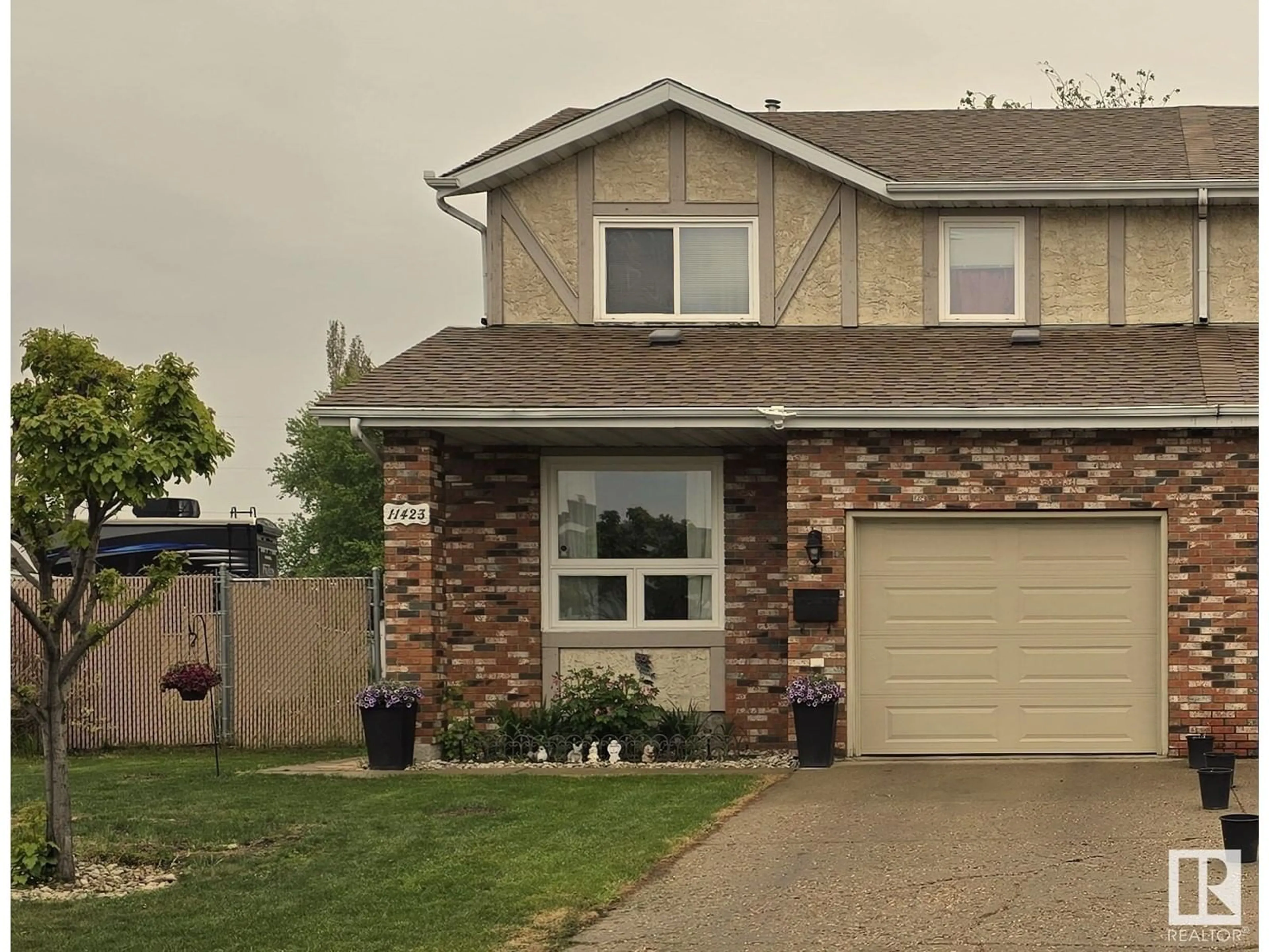 Home with vinyl exterior material, street for 11423 165 AV, Edmonton Alberta T5X3W5