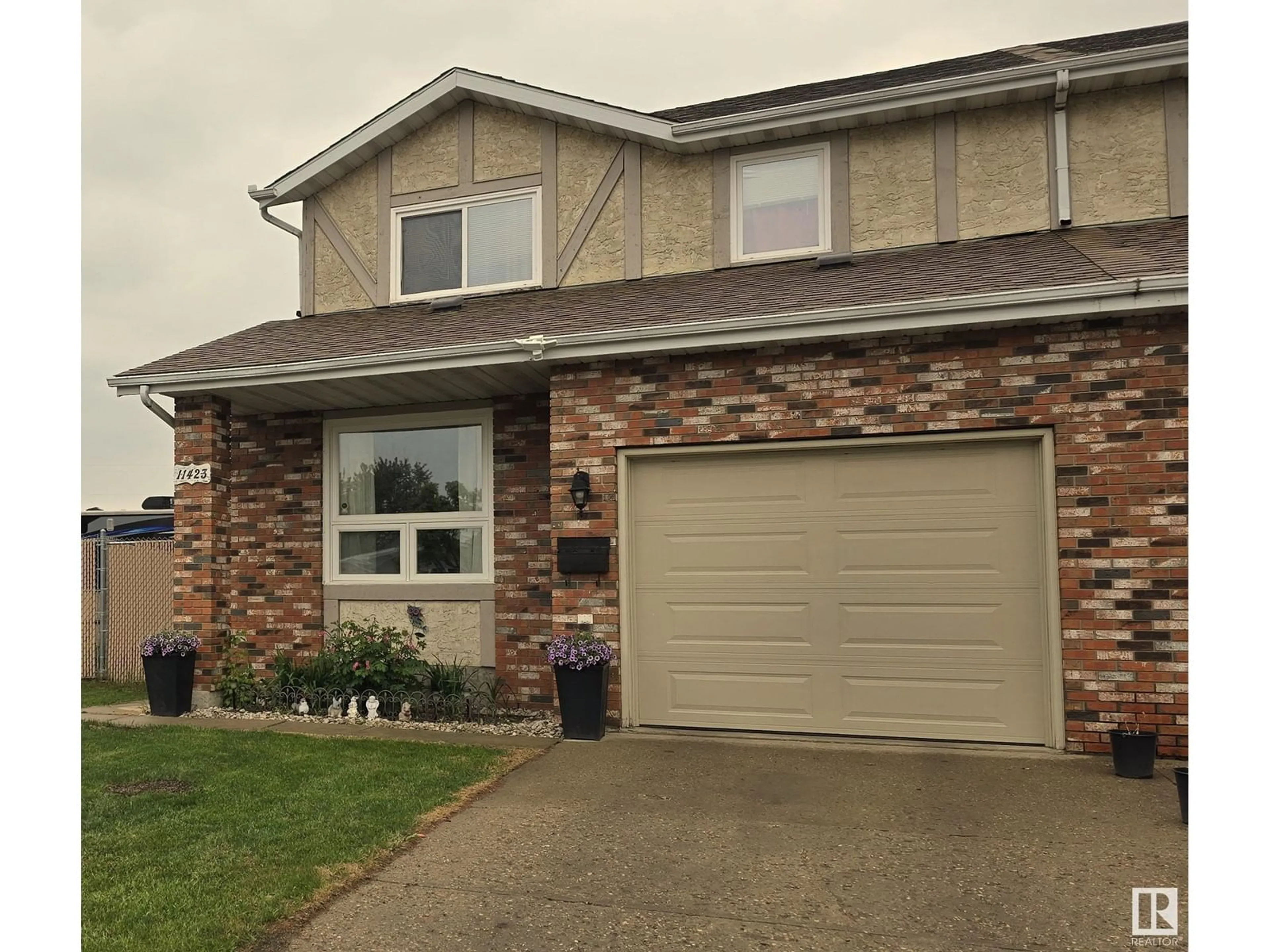 Home with vinyl exterior material, street for 11423 165 AV, Edmonton Alberta T5X3W5