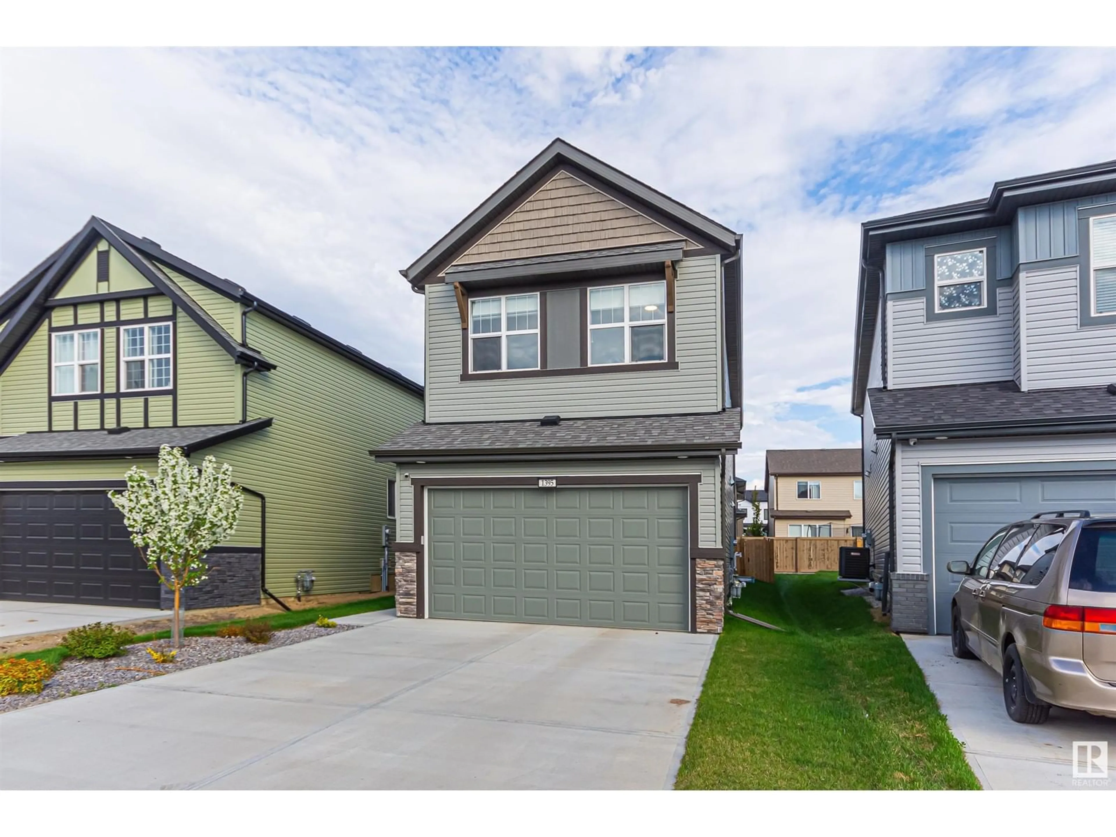 Home with vinyl exterior material, street for 1395 SECORD LANDING NW, Edmonton Alberta T5T7A7