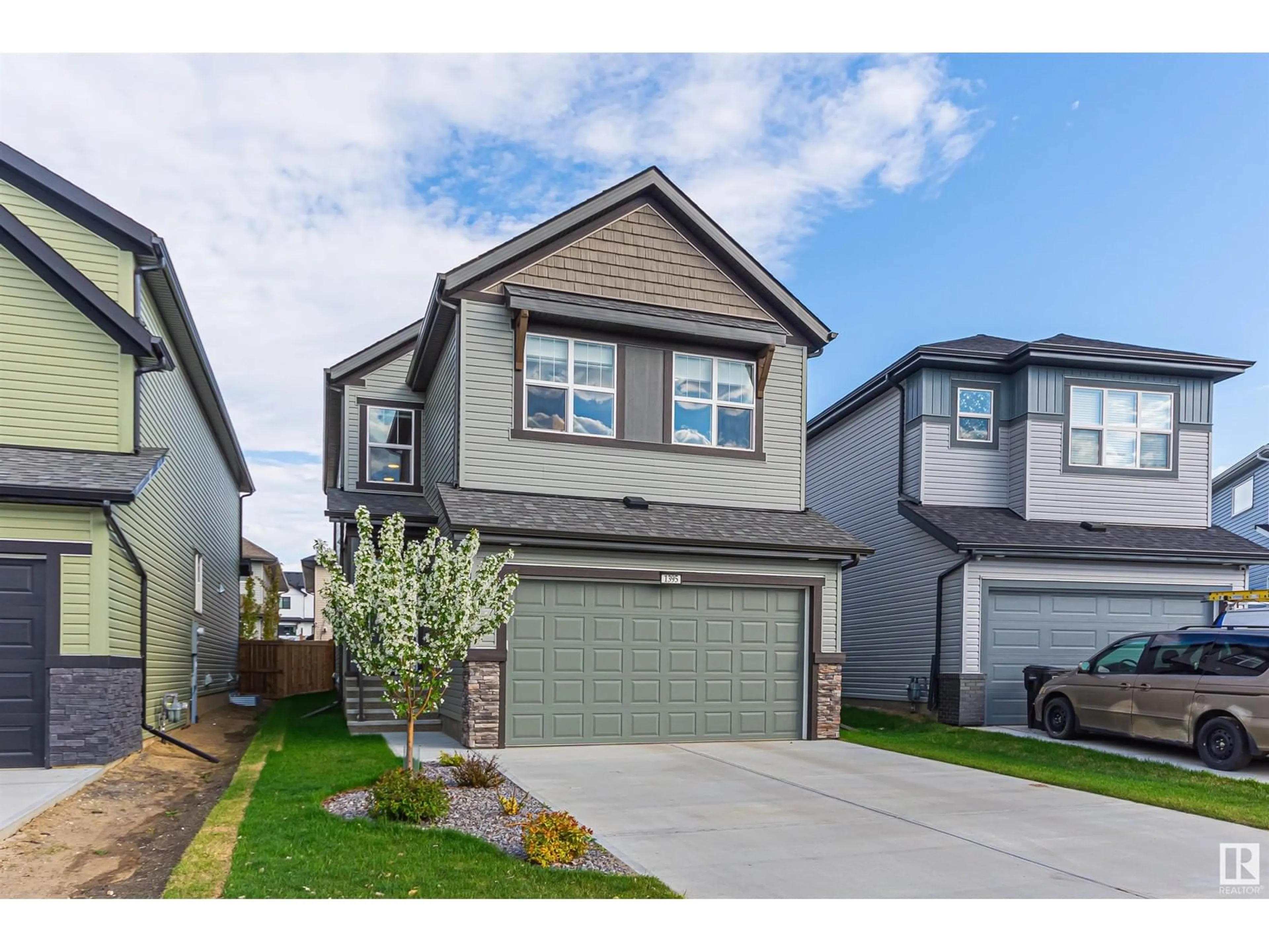 Home with vinyl exterior material, street for 1395 SECORD LANDING NW, Edmonton Alberta T5T7A7