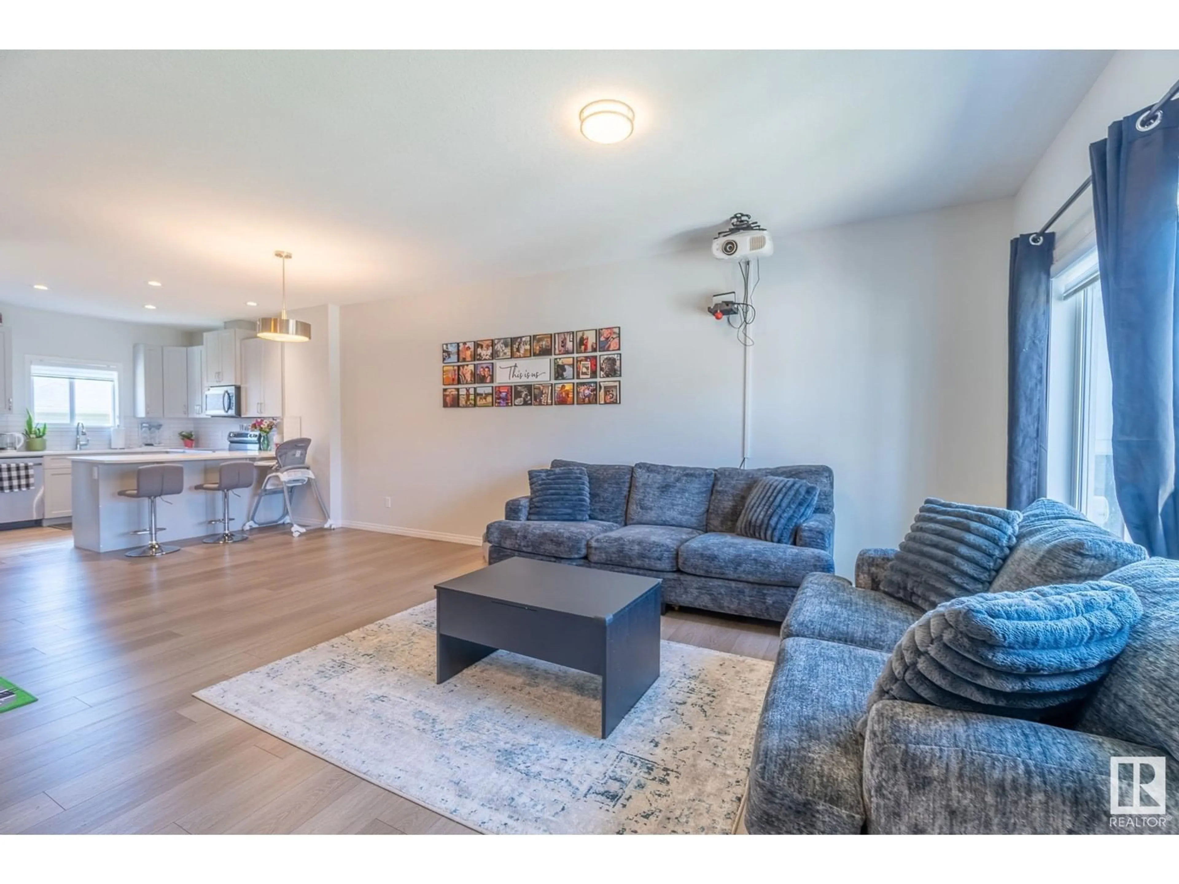 Living room with furniture, wood/laminate floor for 4407 - 4407 38 ST, Beaumont Alberta T4X2Y3
