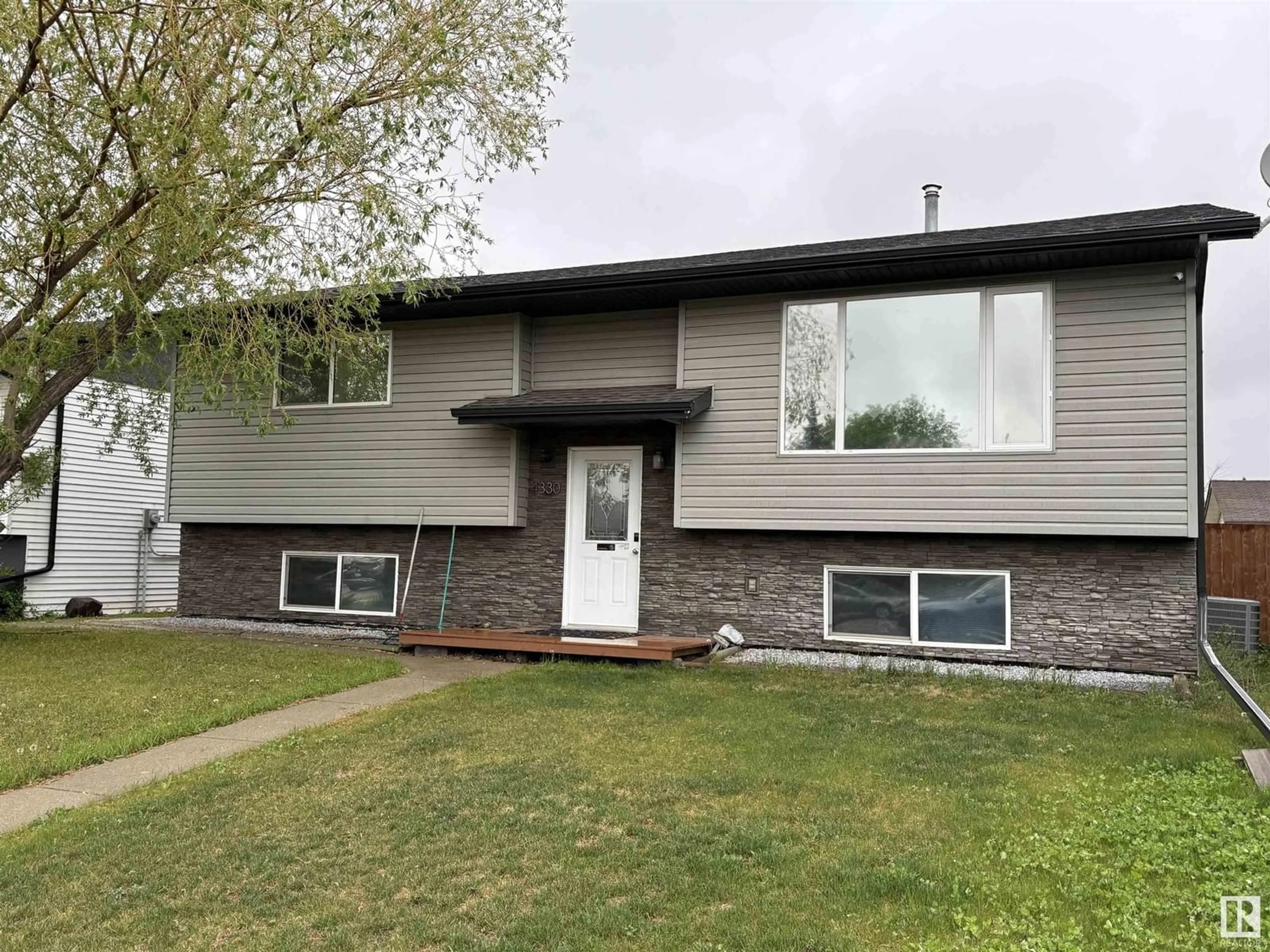 Home with vinyl exterior material, street for 4330 54 AVE, Tofield Alberta T0B4J0