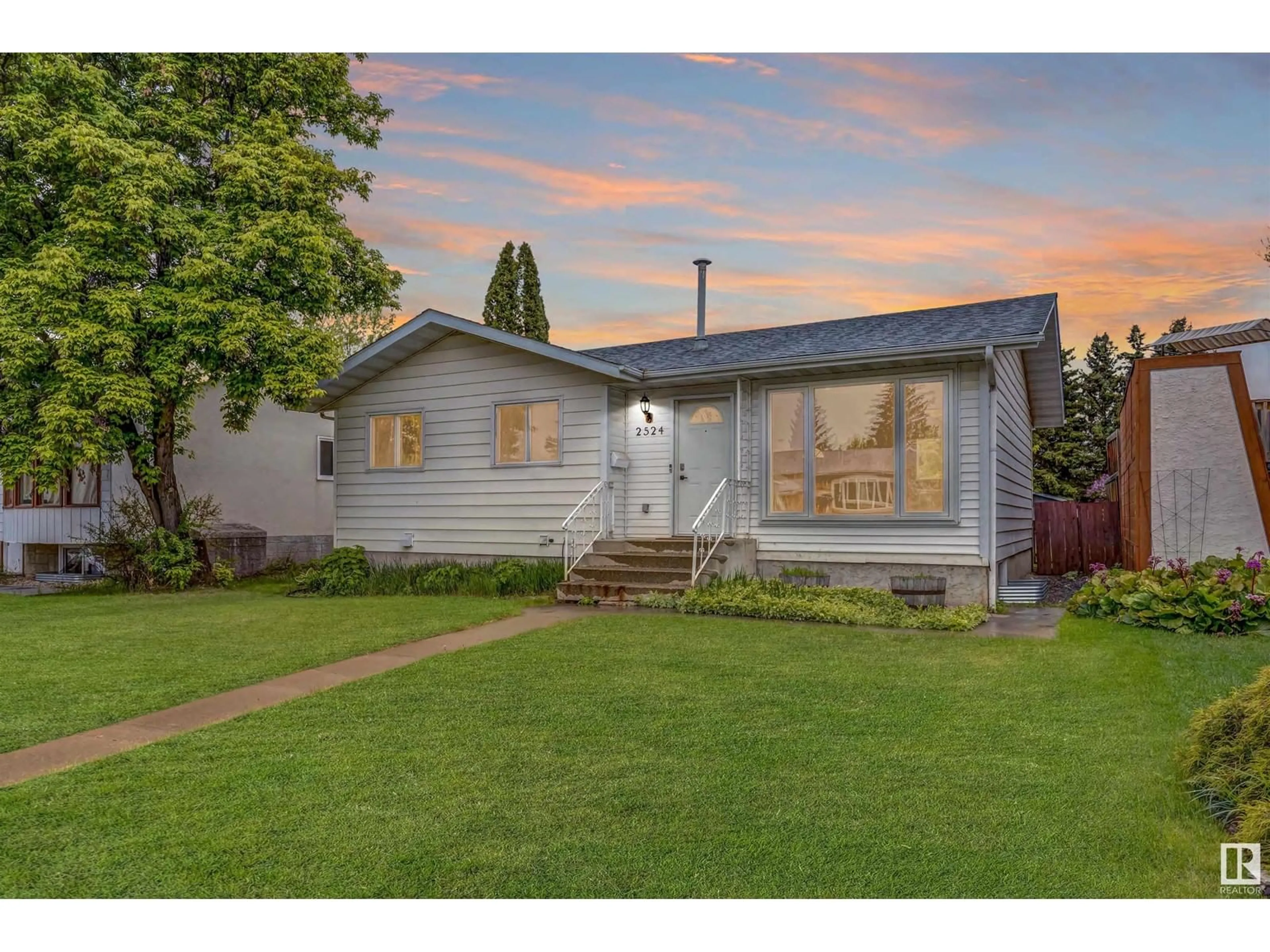 Home with vinyl exterior material, street for 2524 46A ST, Edmonton Alberta T6L3X8