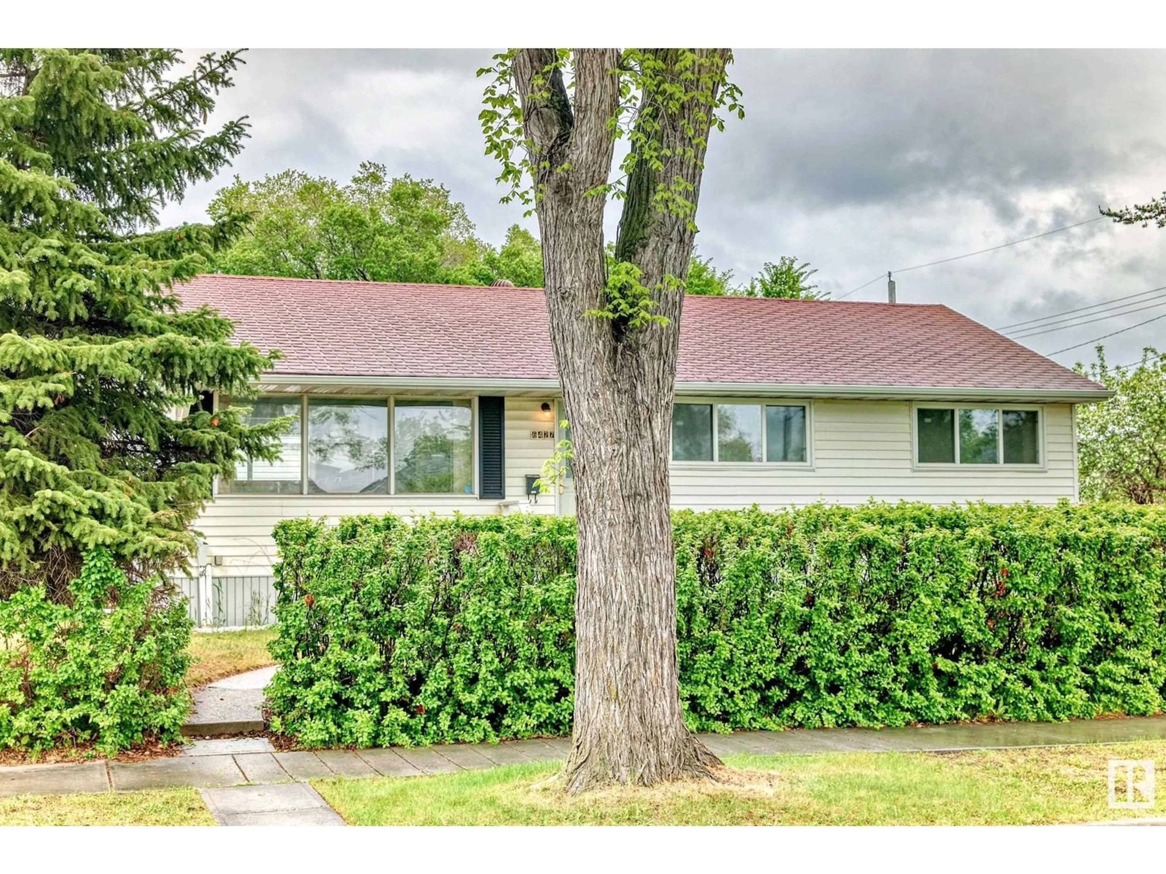 Home with vinyl exterior material, street for 6427 87 ST, Edmonton Alberta T6E2Y5