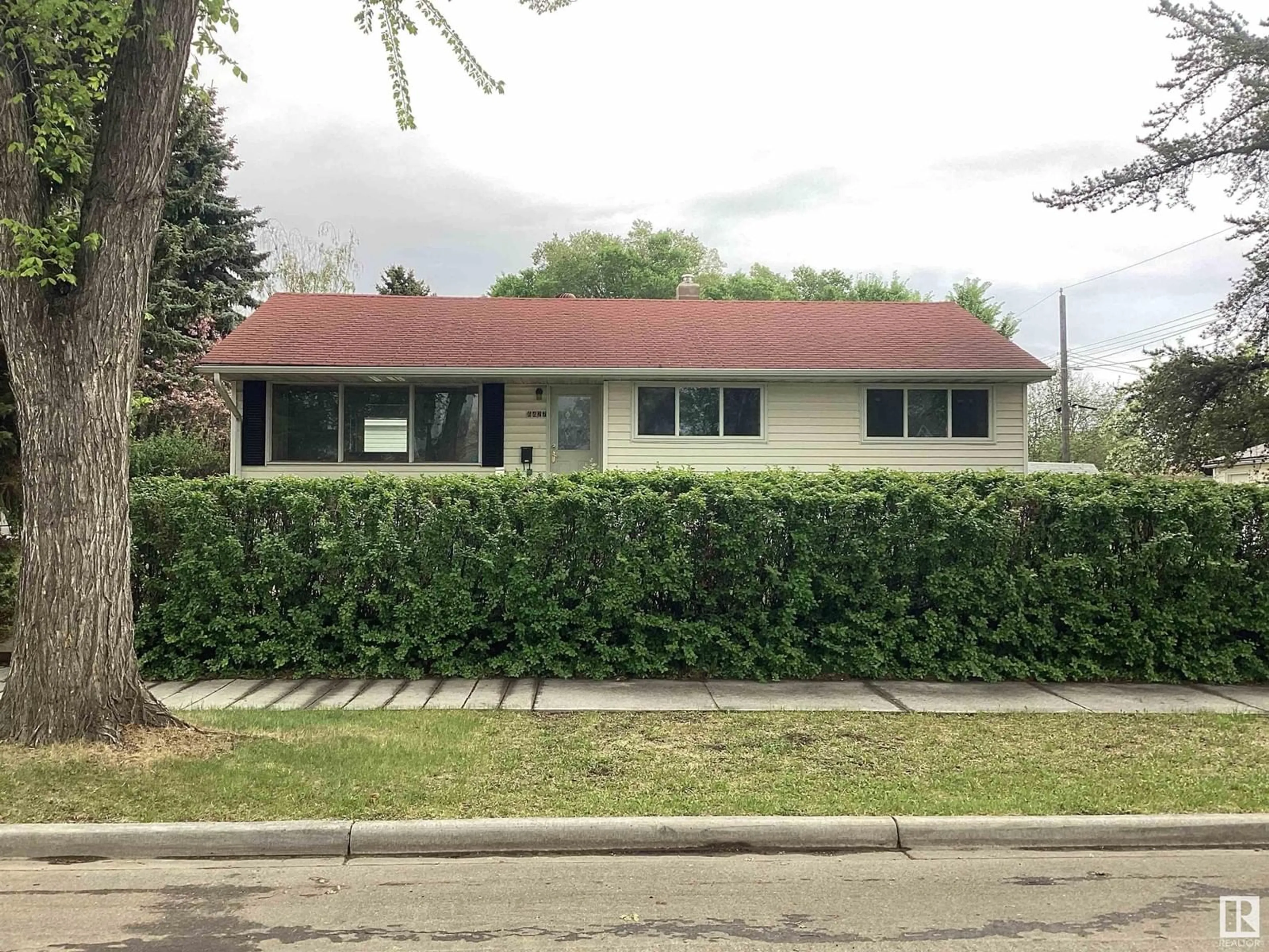 Home with vinyl exterior material, street for 6427 87 ST, Edmonton Alberta T6E2Y5