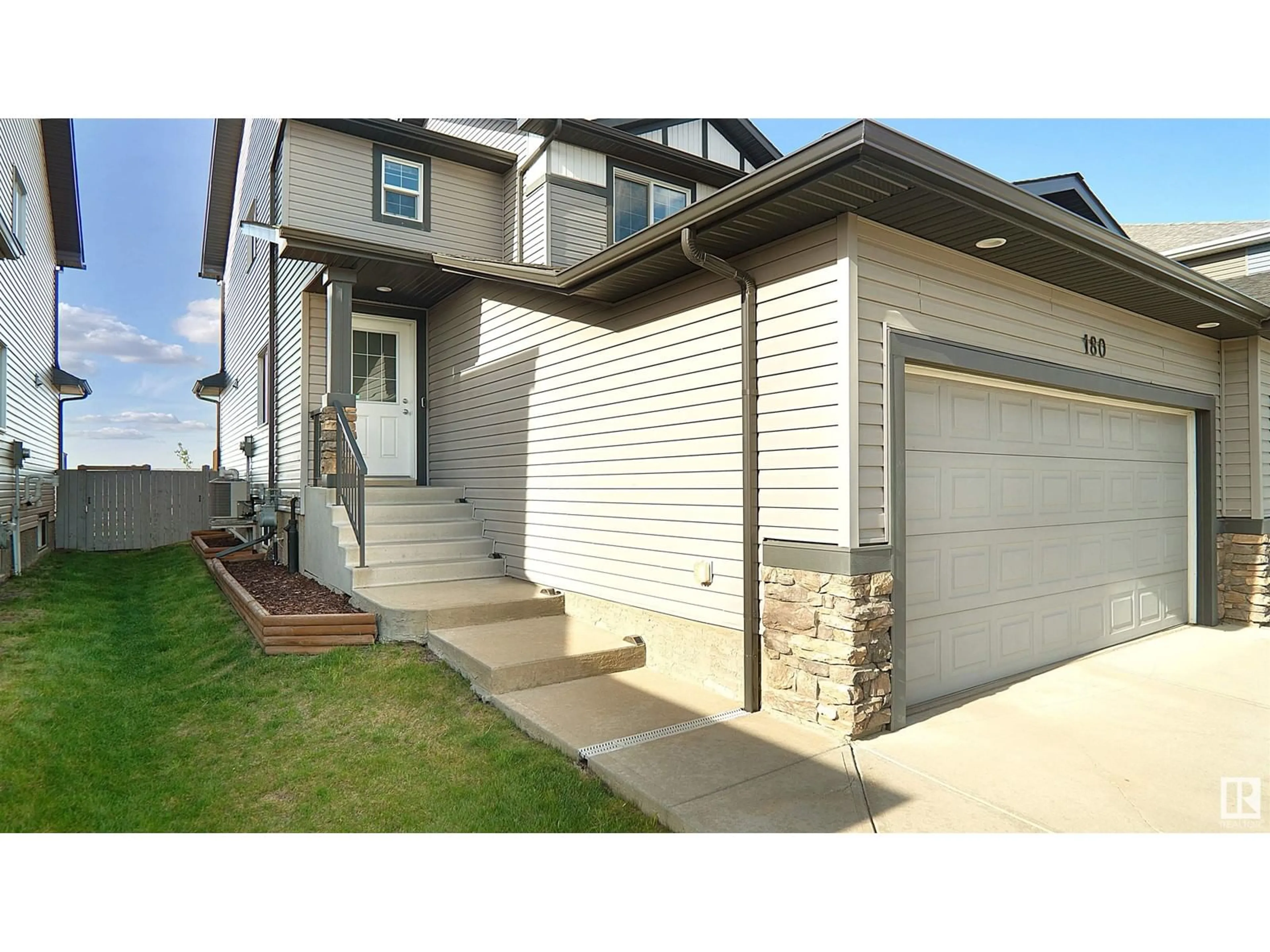 Home with vinyl exterior material, street for 180 REED PL, Leduc Alberta T9E1B1