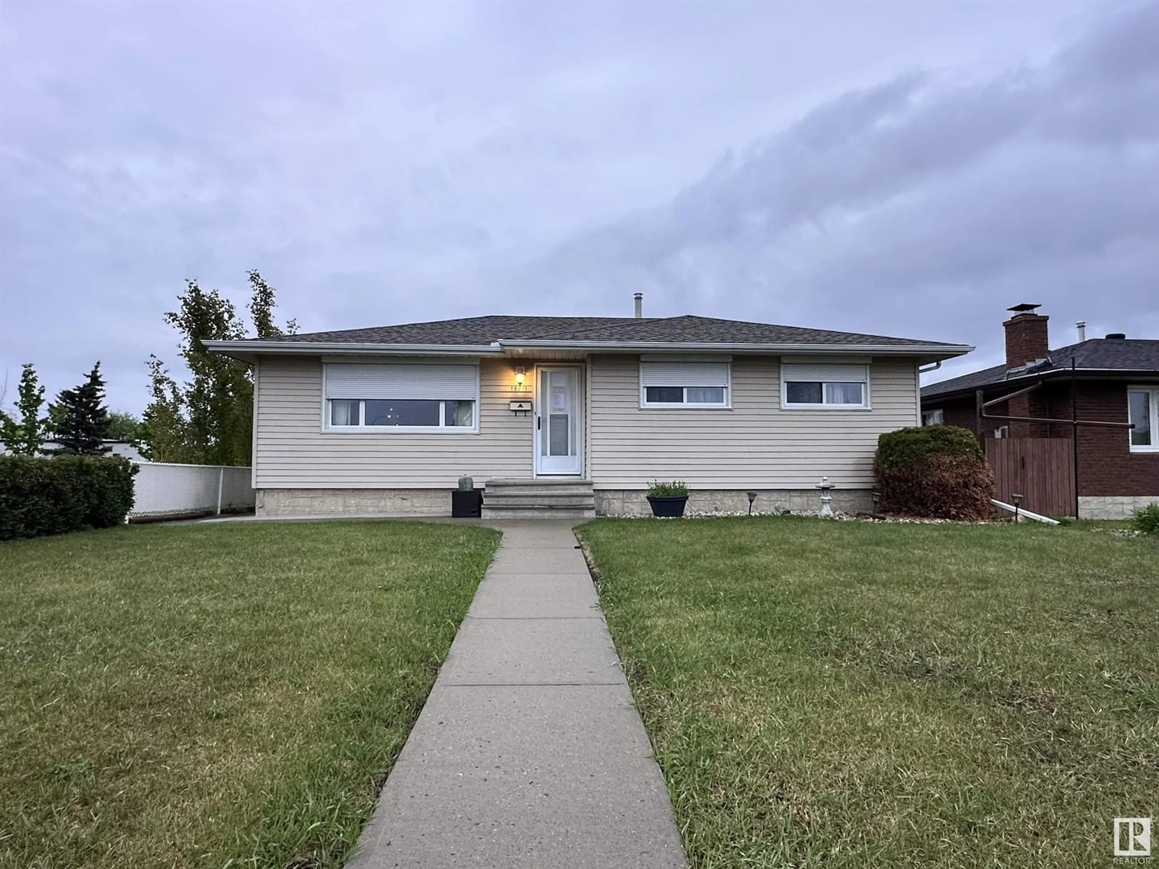 Home with vinyl exterior material, street for 15231 94A ST NW, Edmonton Alberta T5E3X7