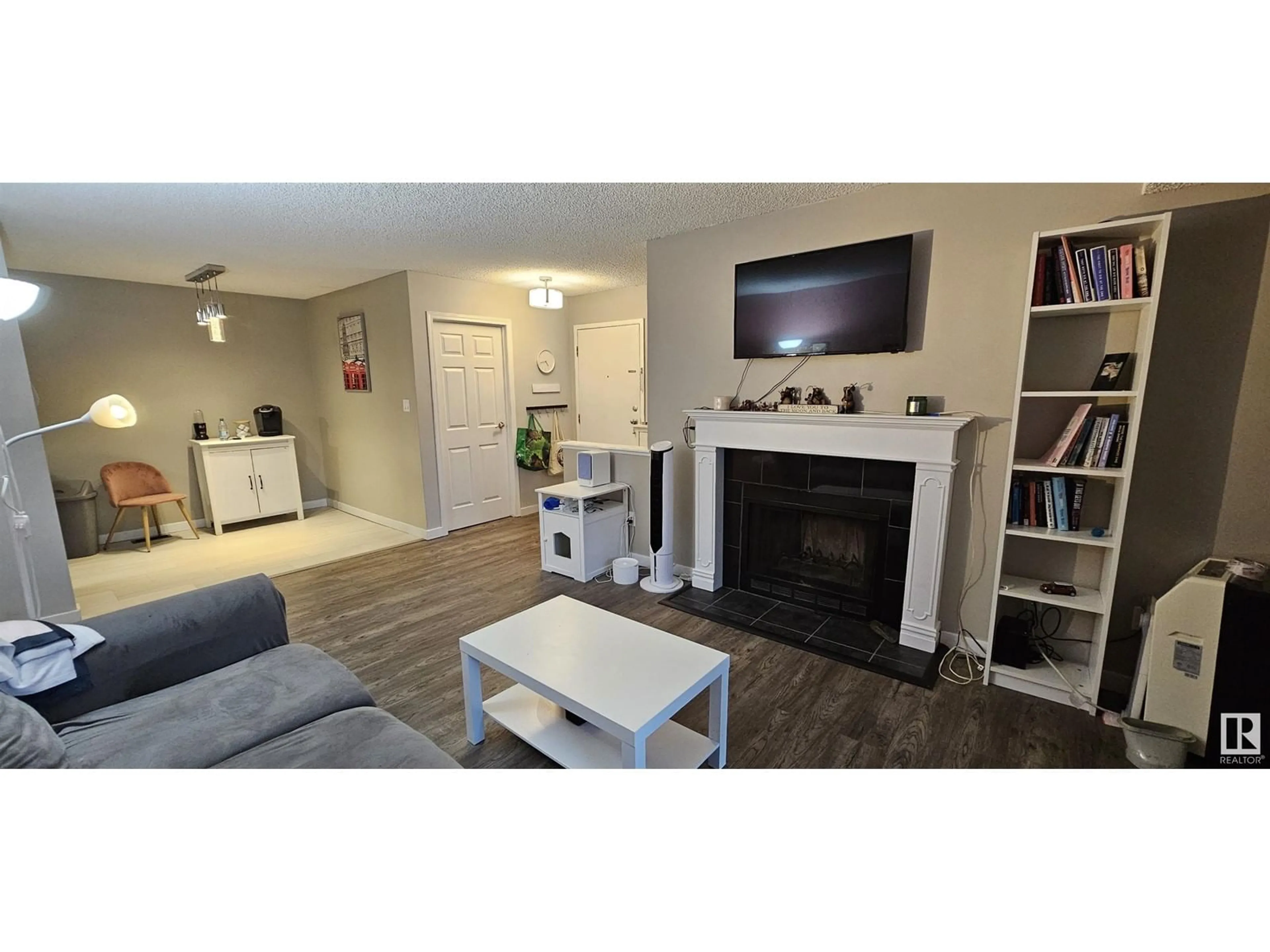 Living room with furniture, wood/laminate floor for 105 AKINS DR, St. Albert Alberta T8N3M6