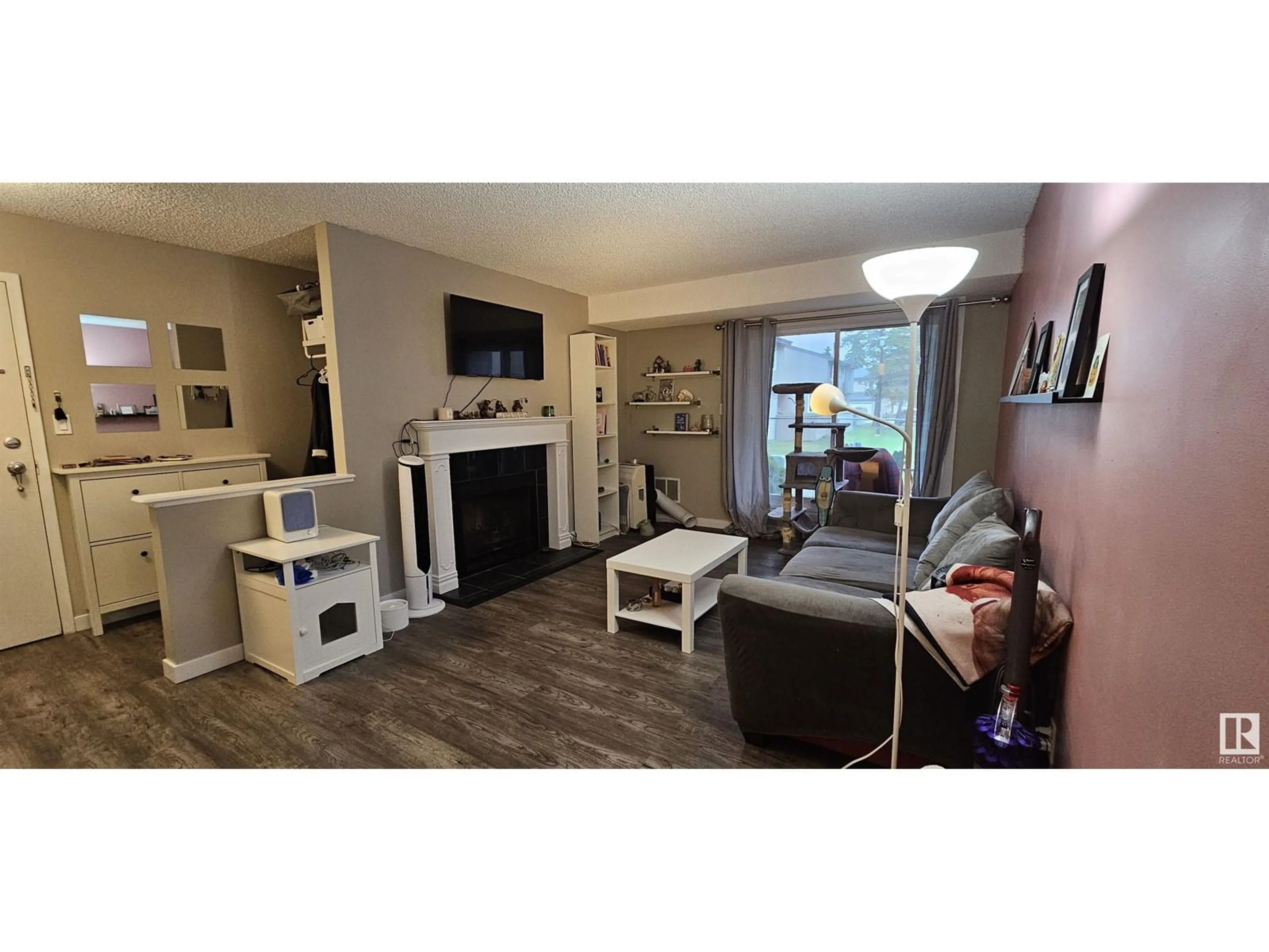 Living room with furniture, wood/laminate floor for 105 AKINS DR, St. Albert Alberta T8N3M6