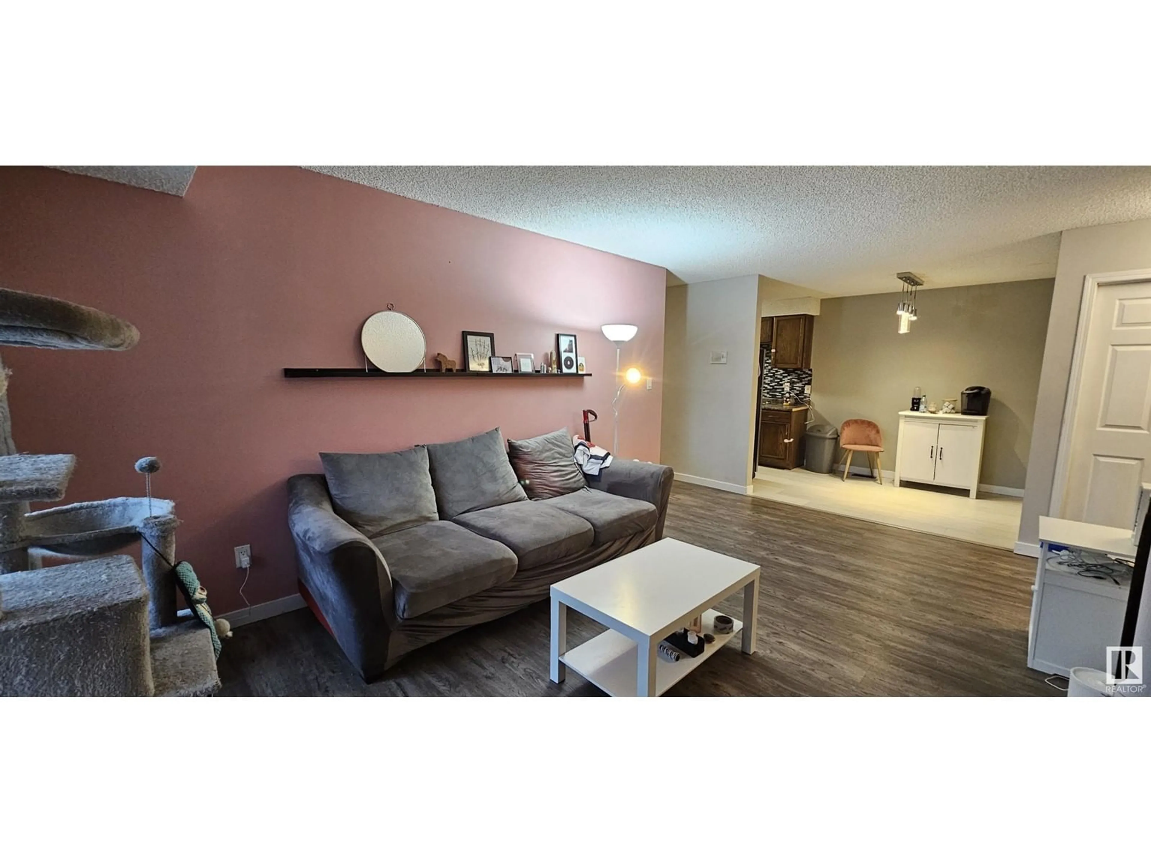 Living room with furniture, wood/laminate floor for 105 AKINS DR, St. Albert Alberta T8N3M6