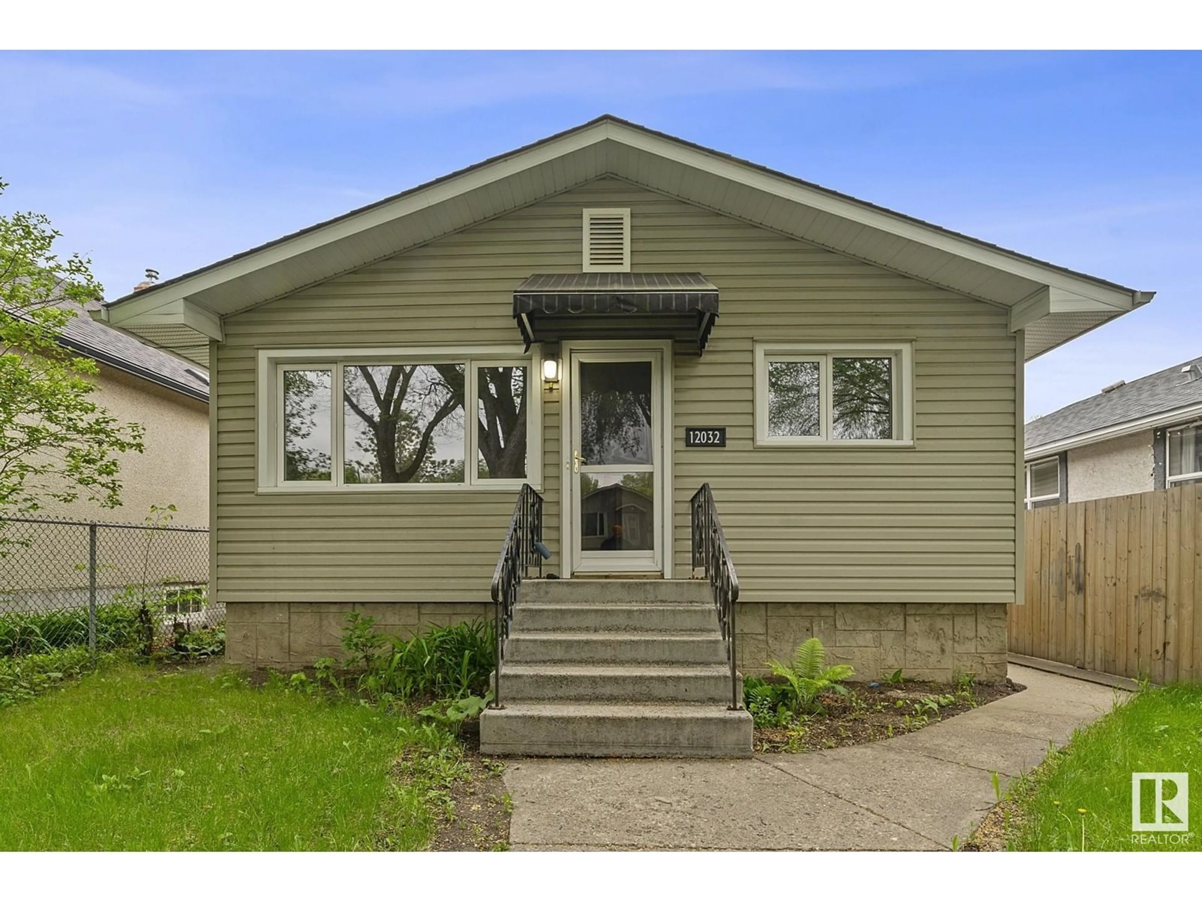 Home with vinyl exterior material, street for 12032 62 ST, Edmonton Alberta T5W4C8