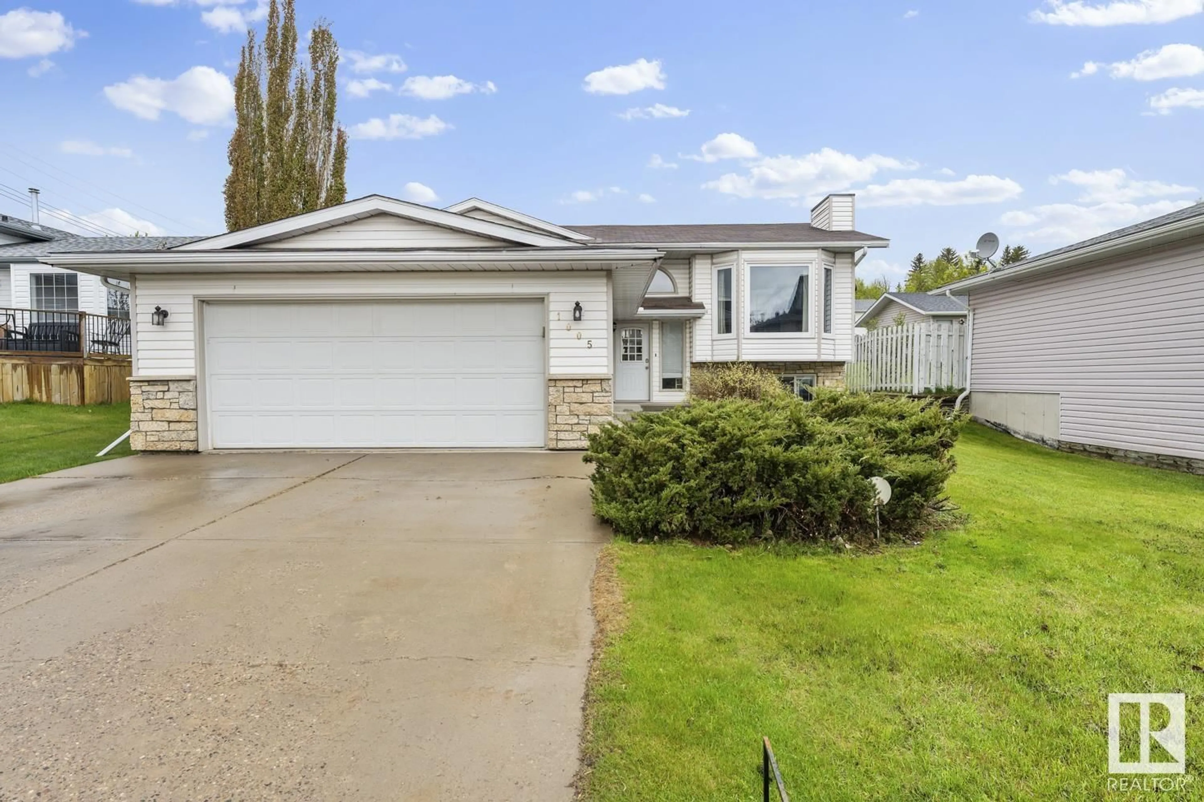 Home with vinyl exterior material, street for 1005 11 ST, Cold Lake Alberta T9M1K2