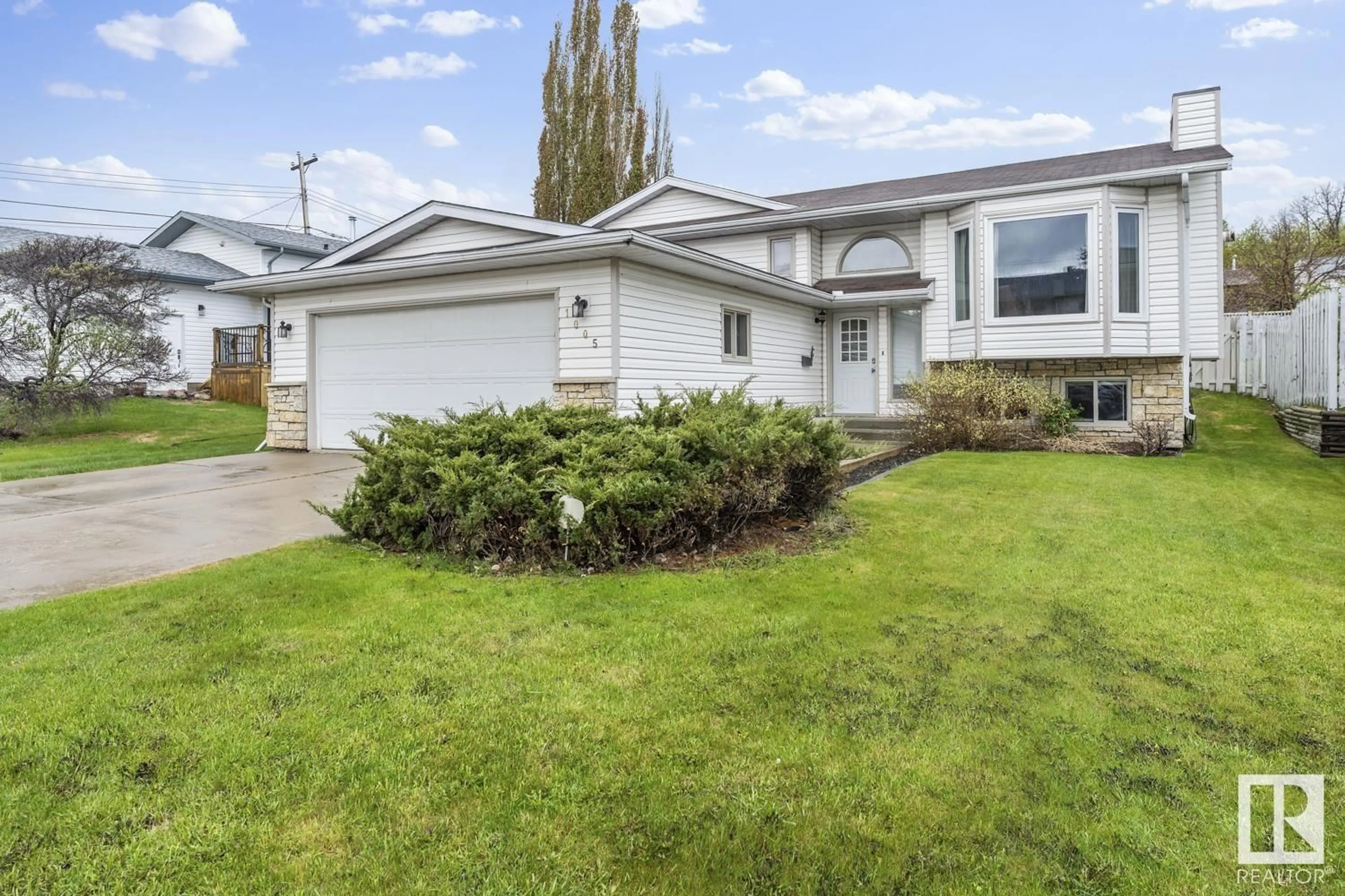 Home with vinyl exterior material, street for 1005 11 ST, Cold Lake Alberta T9M1K2