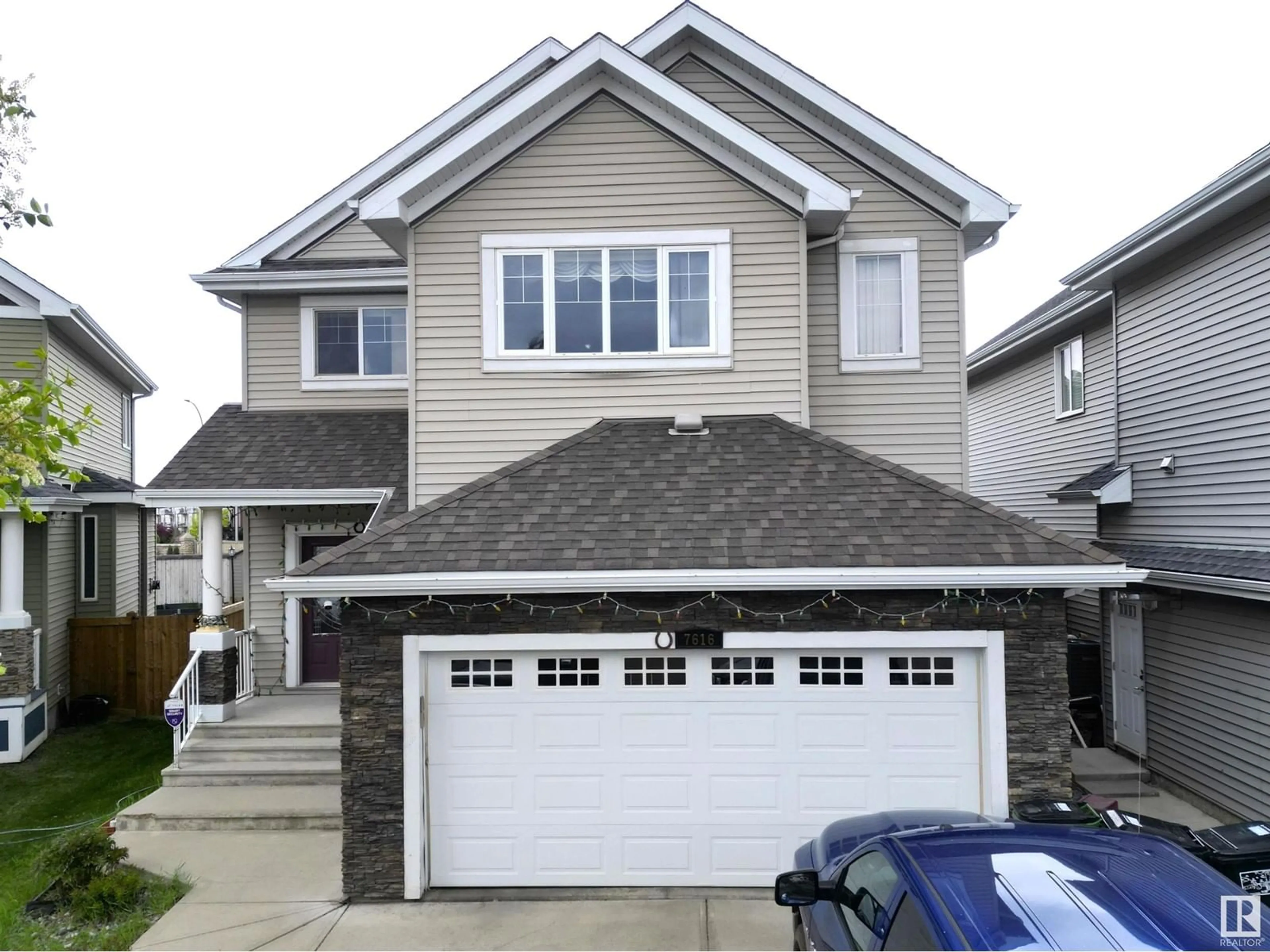 Home with vinyl exterior material, street for 7616 10 AV, Edmonton Alberta T6X0N6