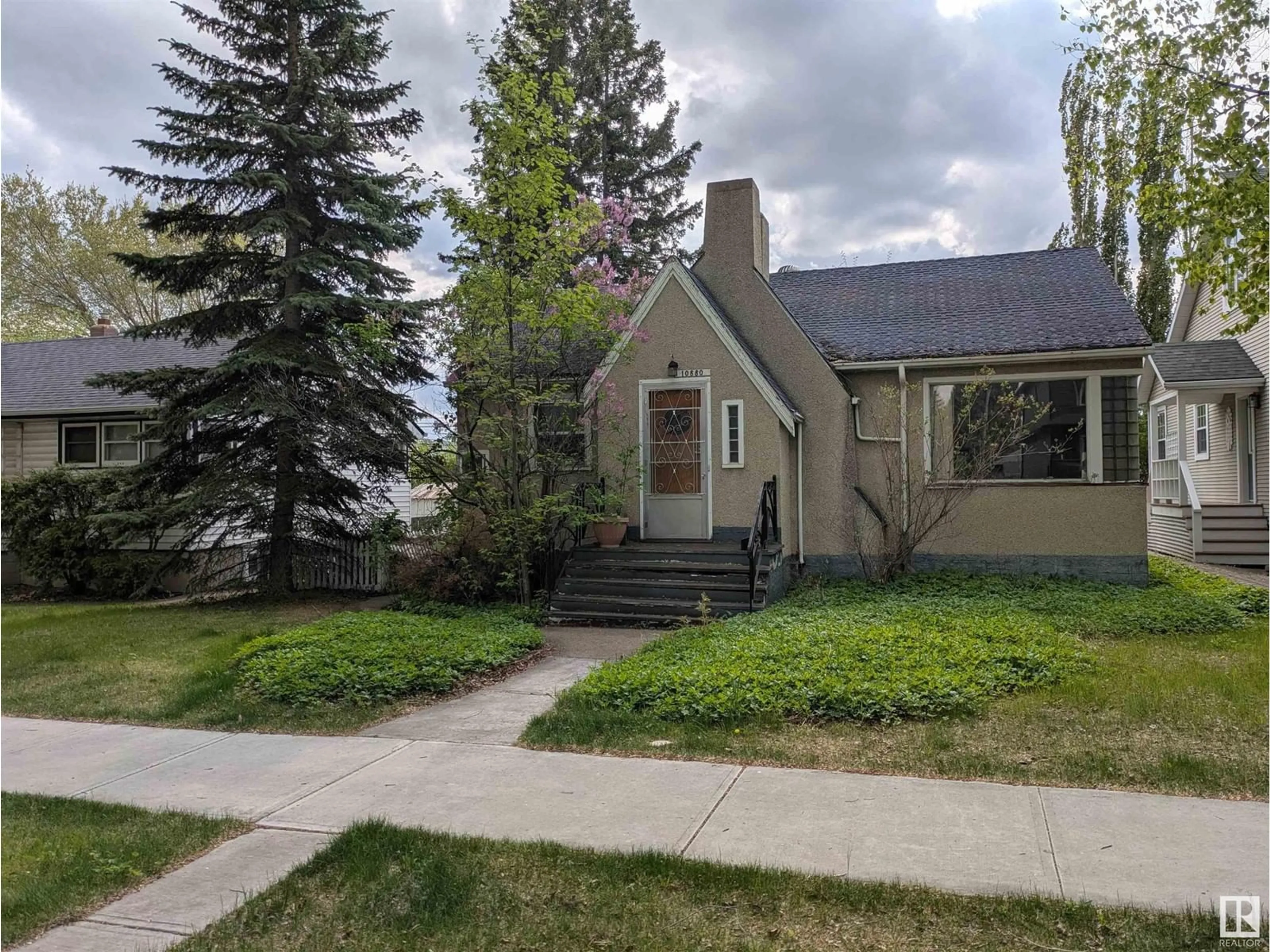 Home with vinyl exterior material, street for 10880 74 ST, Edmonton Alberta T5B1Z9