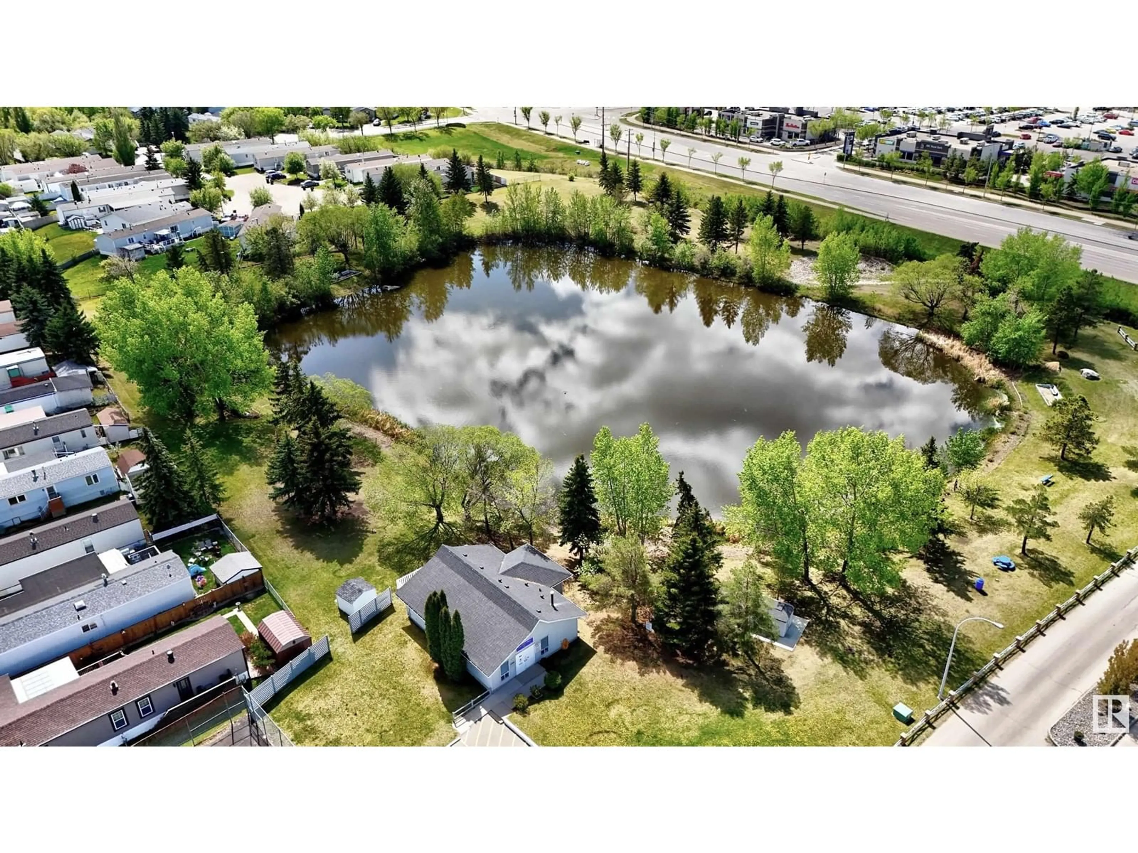 A pic from outside/outdoor area/front of a property/back of a property/a pic from drone, water/lake/river/ocean view for 1161 LAKEVISTA DR, Sherwood Park Alberta T8H1K1