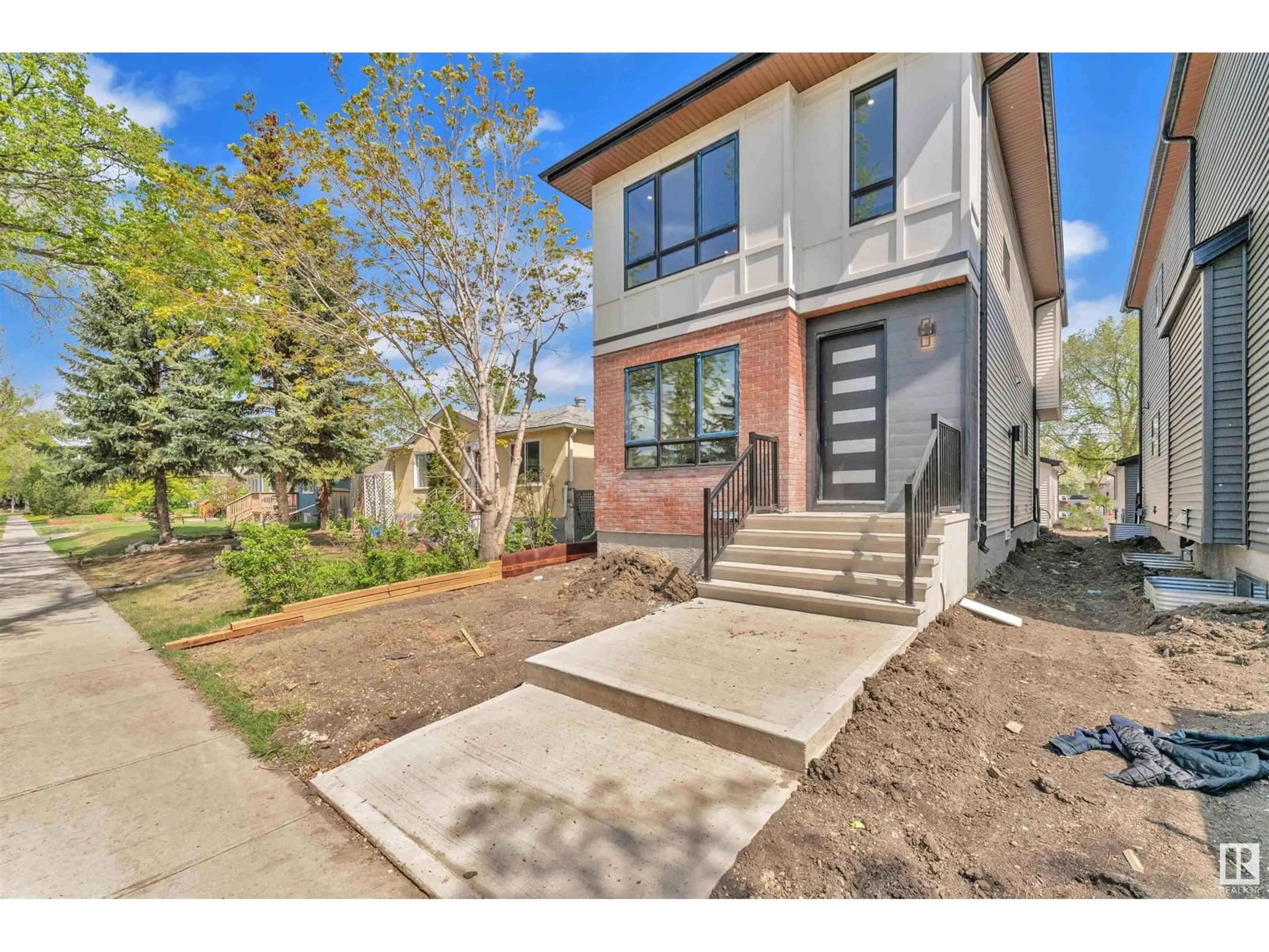 Home with brick exterior material, street for NW - 10725 132 ST, Edmonton Alberta T5M1C8