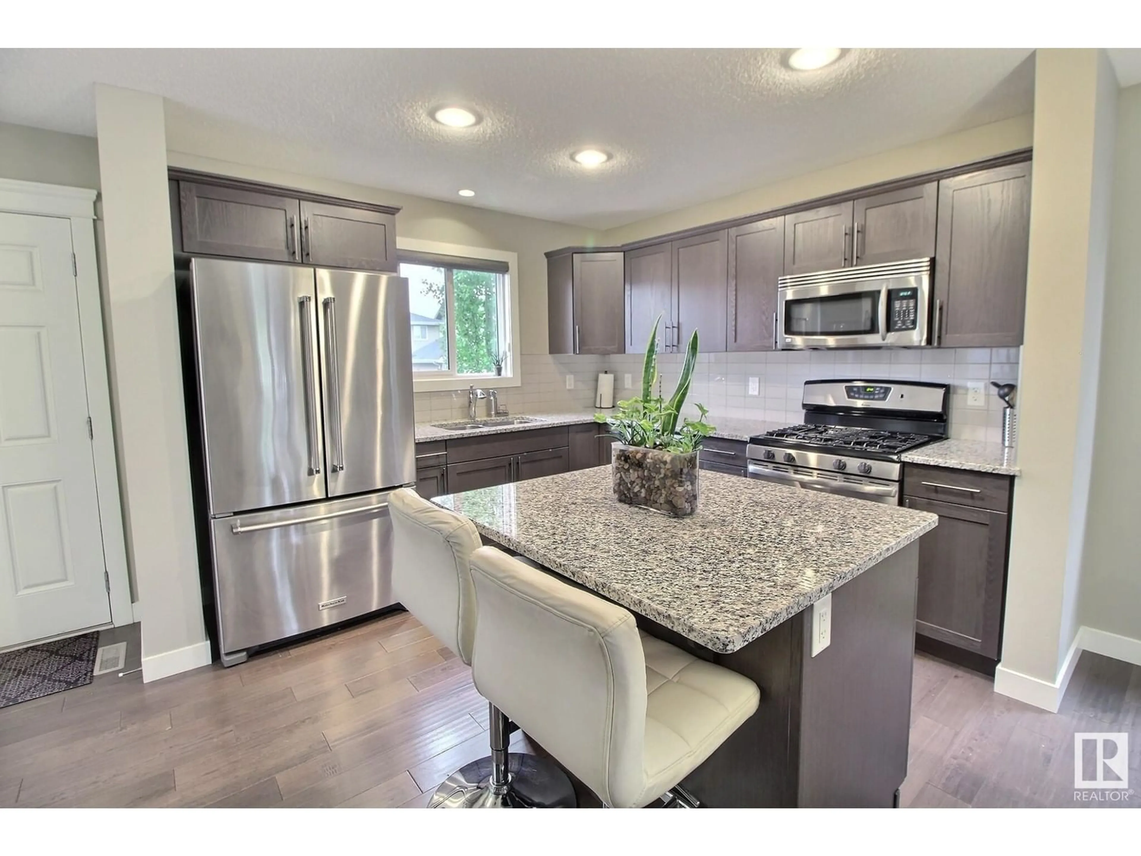 Open concept kitchen, ceramic/tile floor for 16020 12 AV, Edmonton Alberta T6W2W6