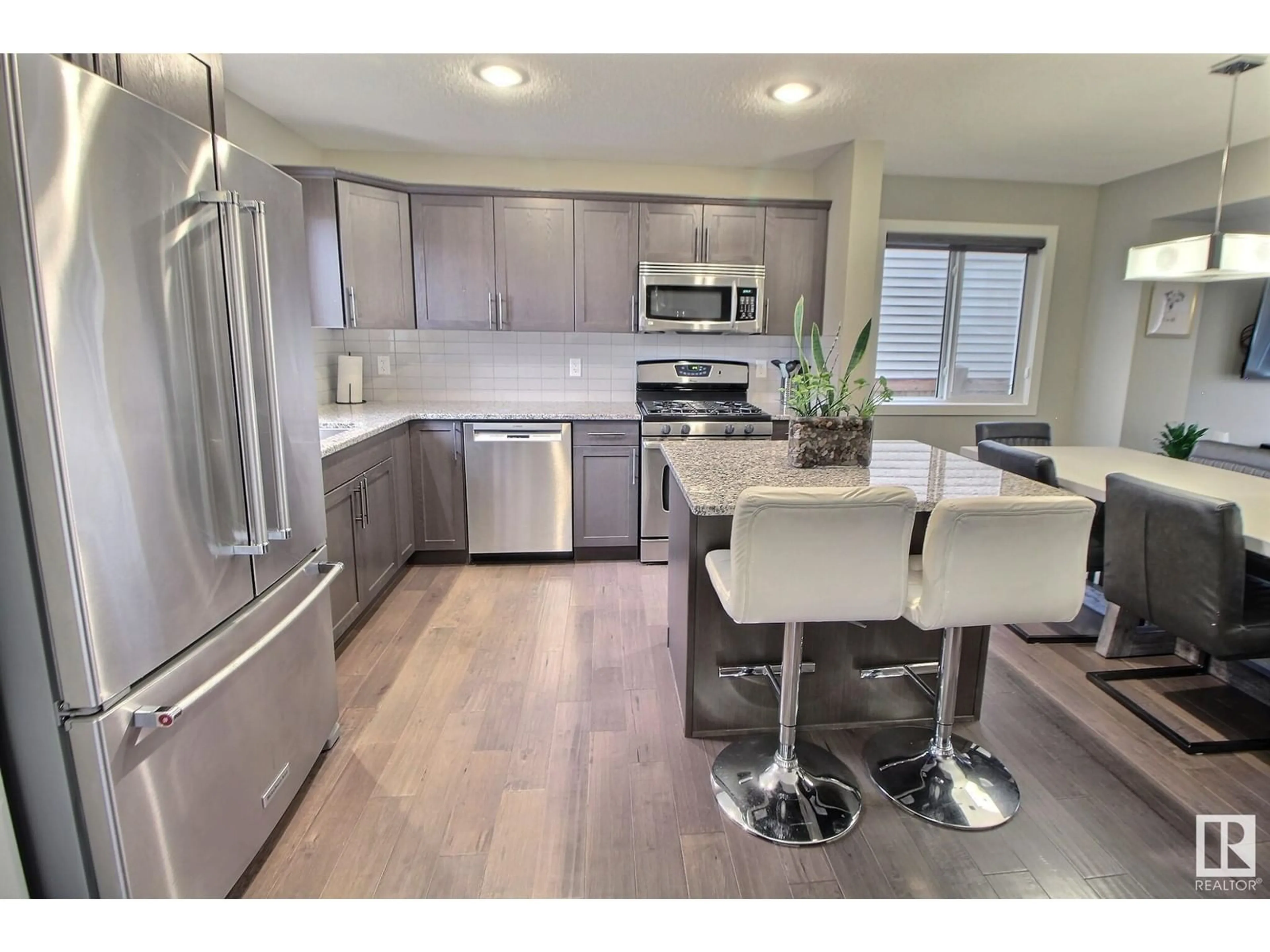 Open concept kitchen, unknown for 16020 12 AV, Edmonton Alberta T6W2W6