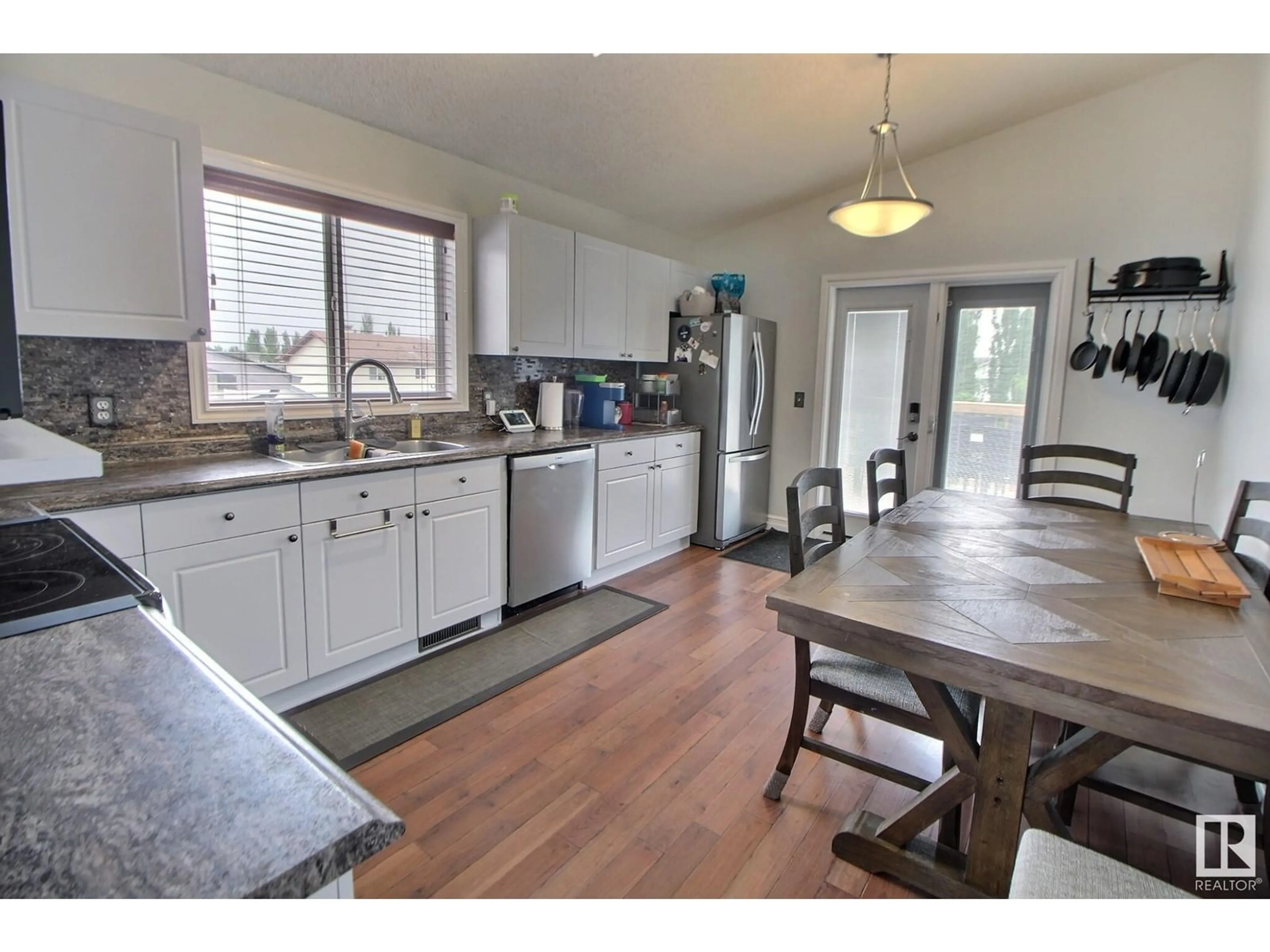 Open concept kitchen, wood/laminate floor for 95 LANDSDOWNE DR, Spruce Grove Alberta T7X3Z8