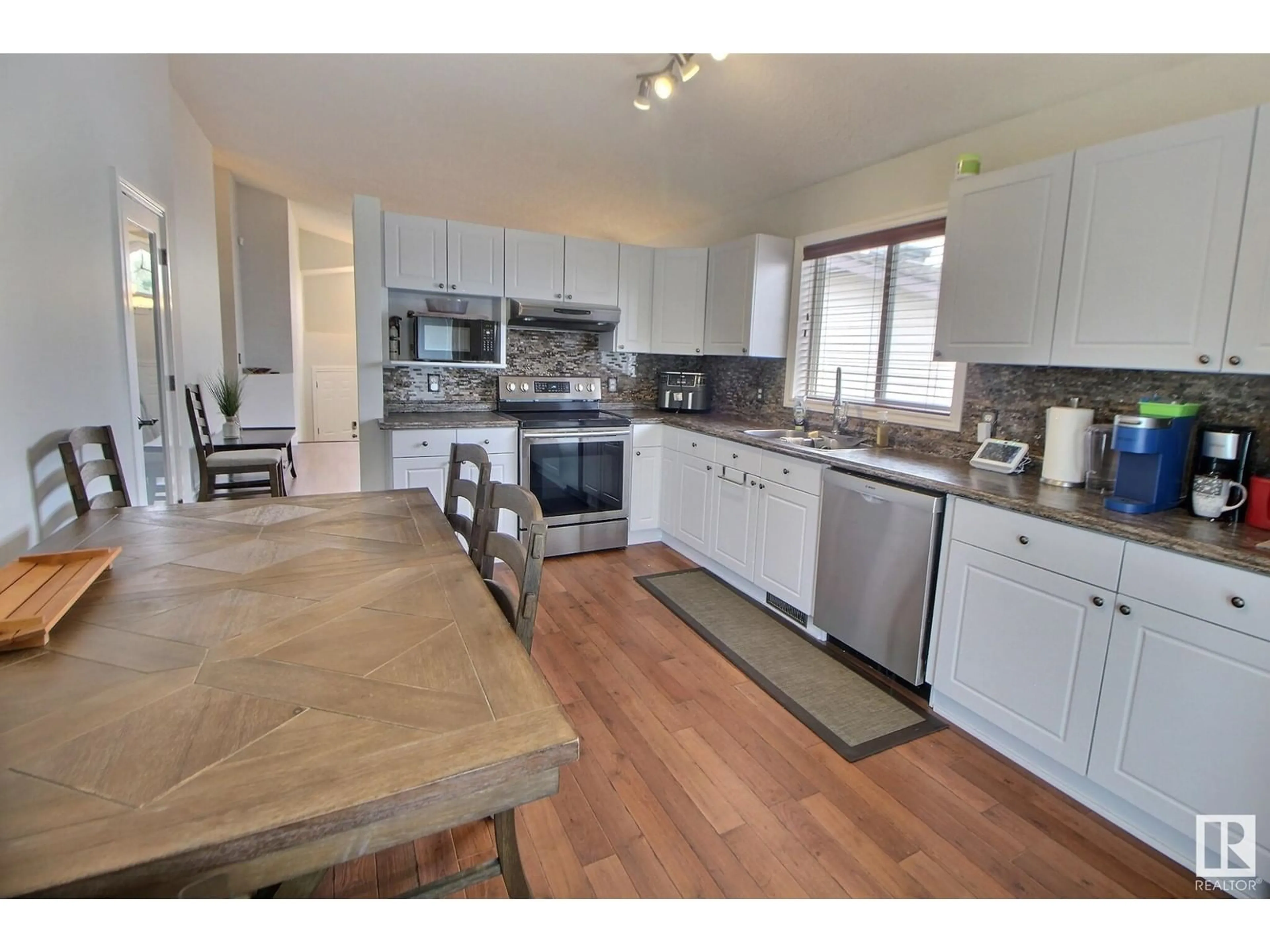 Open concept kitchen, wood/laminate floor for 95 LANDSDOWNE DR, Spruce Grove Alberta T7X3Z8