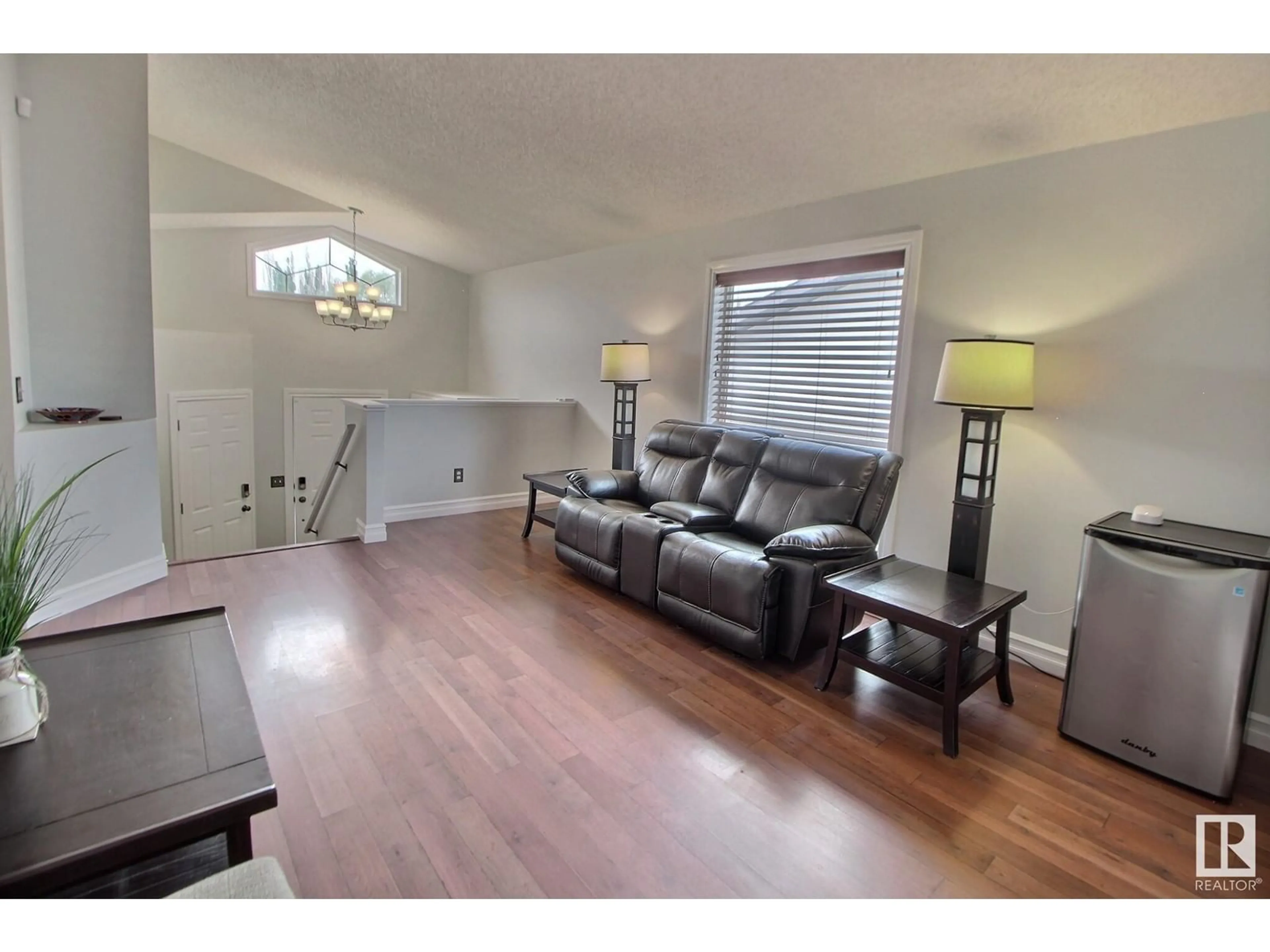Living room with furniture, wood/laminate floor for 95 LANDSDOWNE DR, Spruce Grove Alberta T7X3Z8