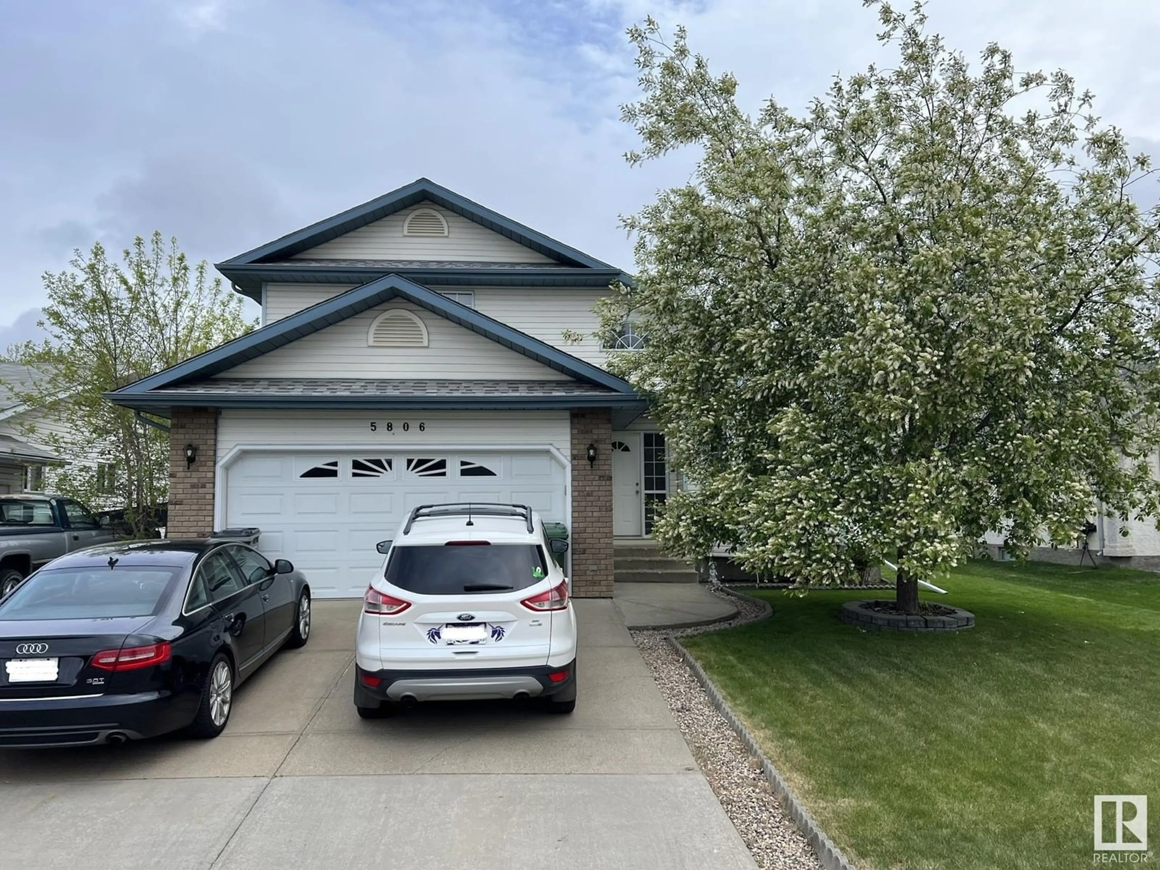 Home with vinyl exterior material, street for 5806 49 AV, Beaumont Alberta T4X1C2
