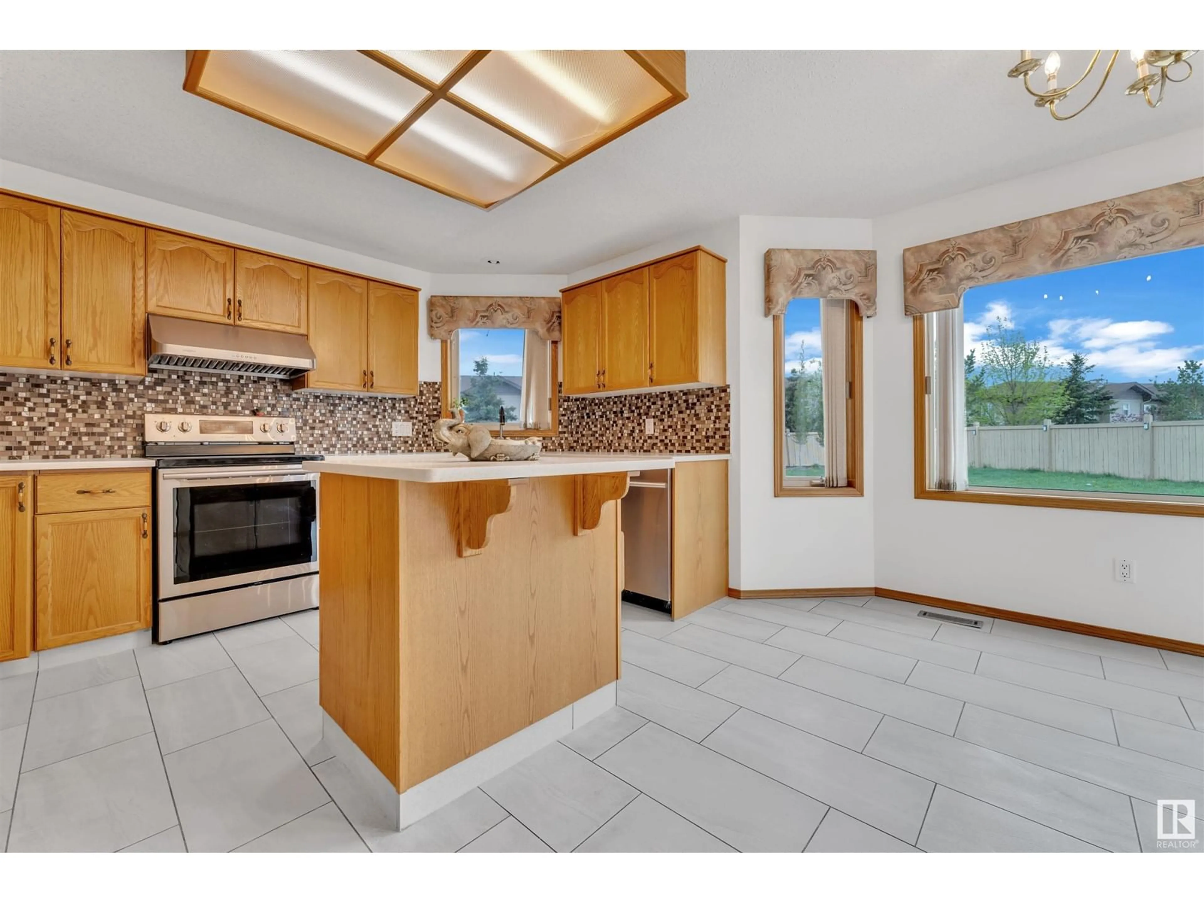 Open concept kitchen, ceramic/tile floor for 14024 128 ST NW, Edmonton Alberta T6V1K7