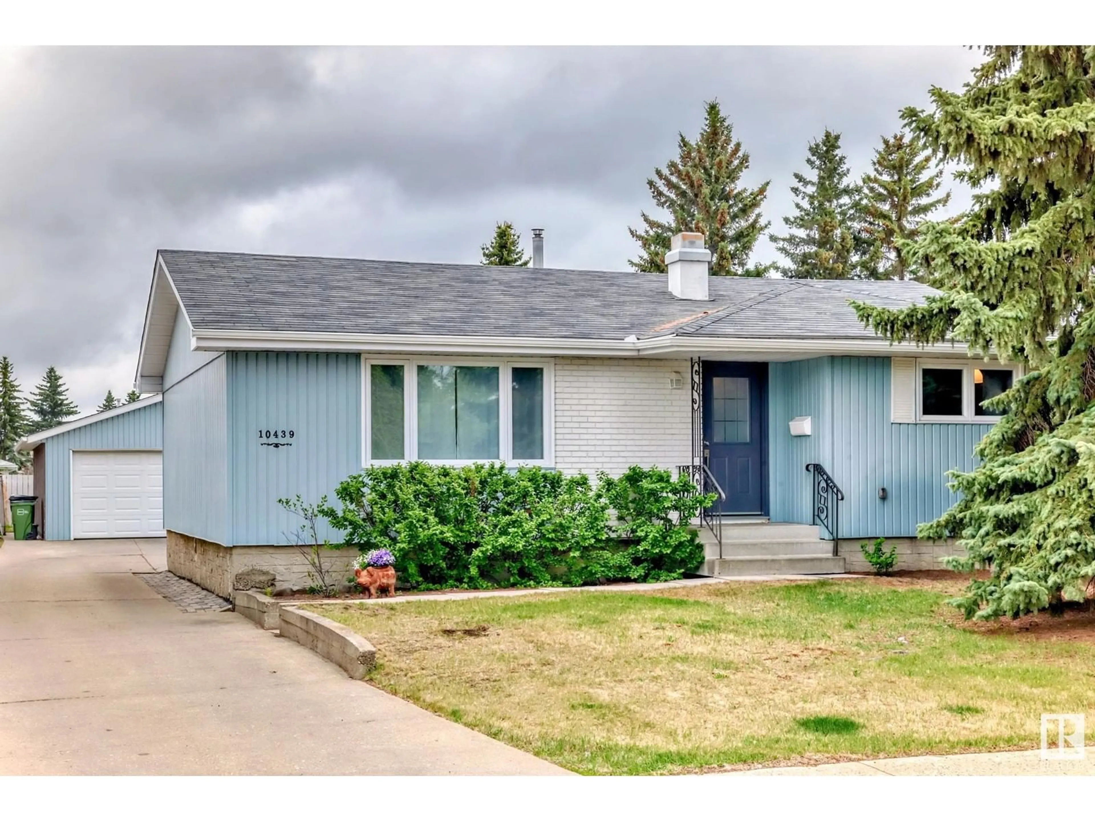 Home with vinyl exterior material, street for 10439 37 AV, Edmonton Alberta T6K2H9