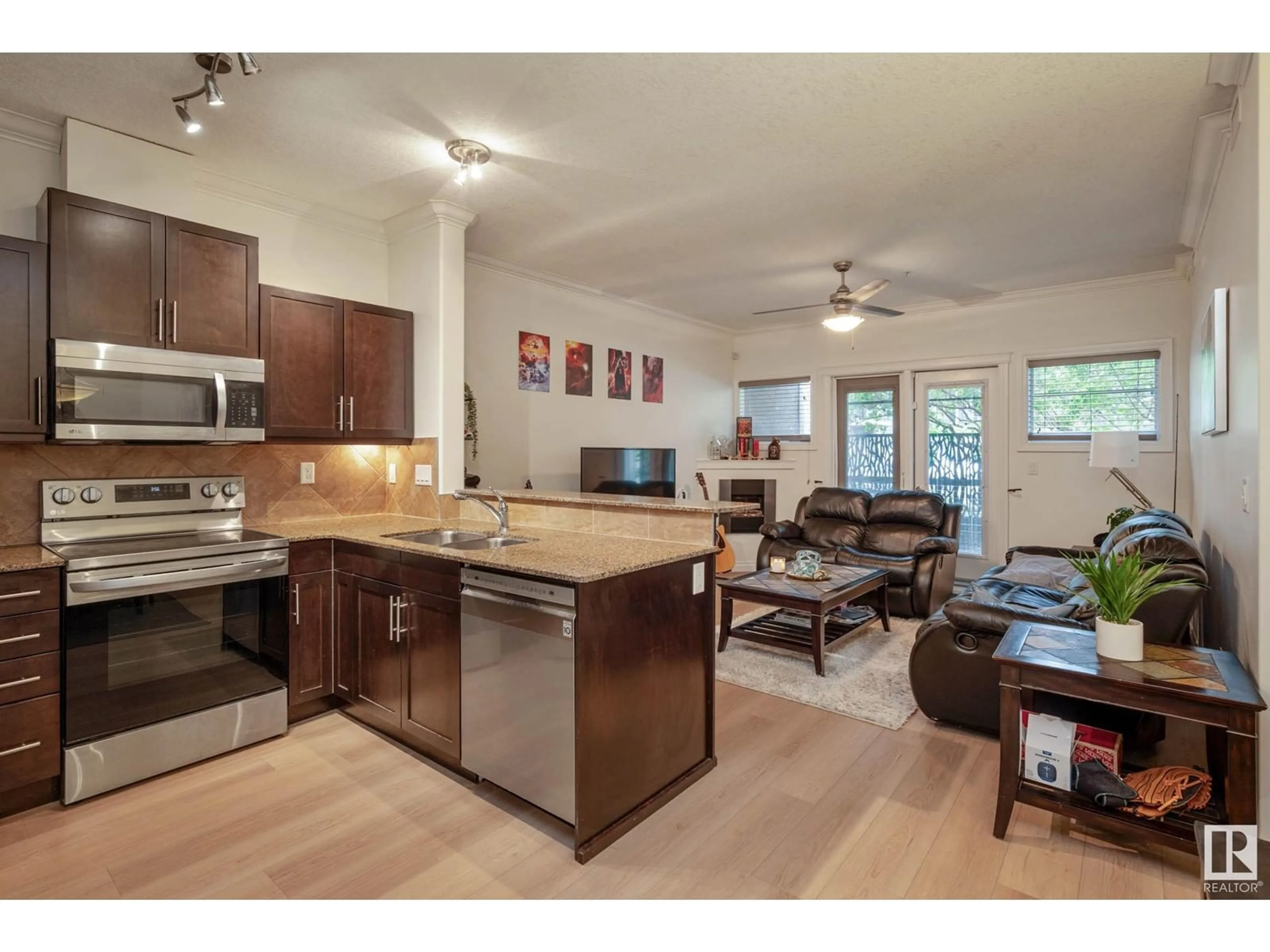 Open concept kitchen, wood/laminate floor for #134 - 10121 80 AV, Edmonton Alberta T6E0B9