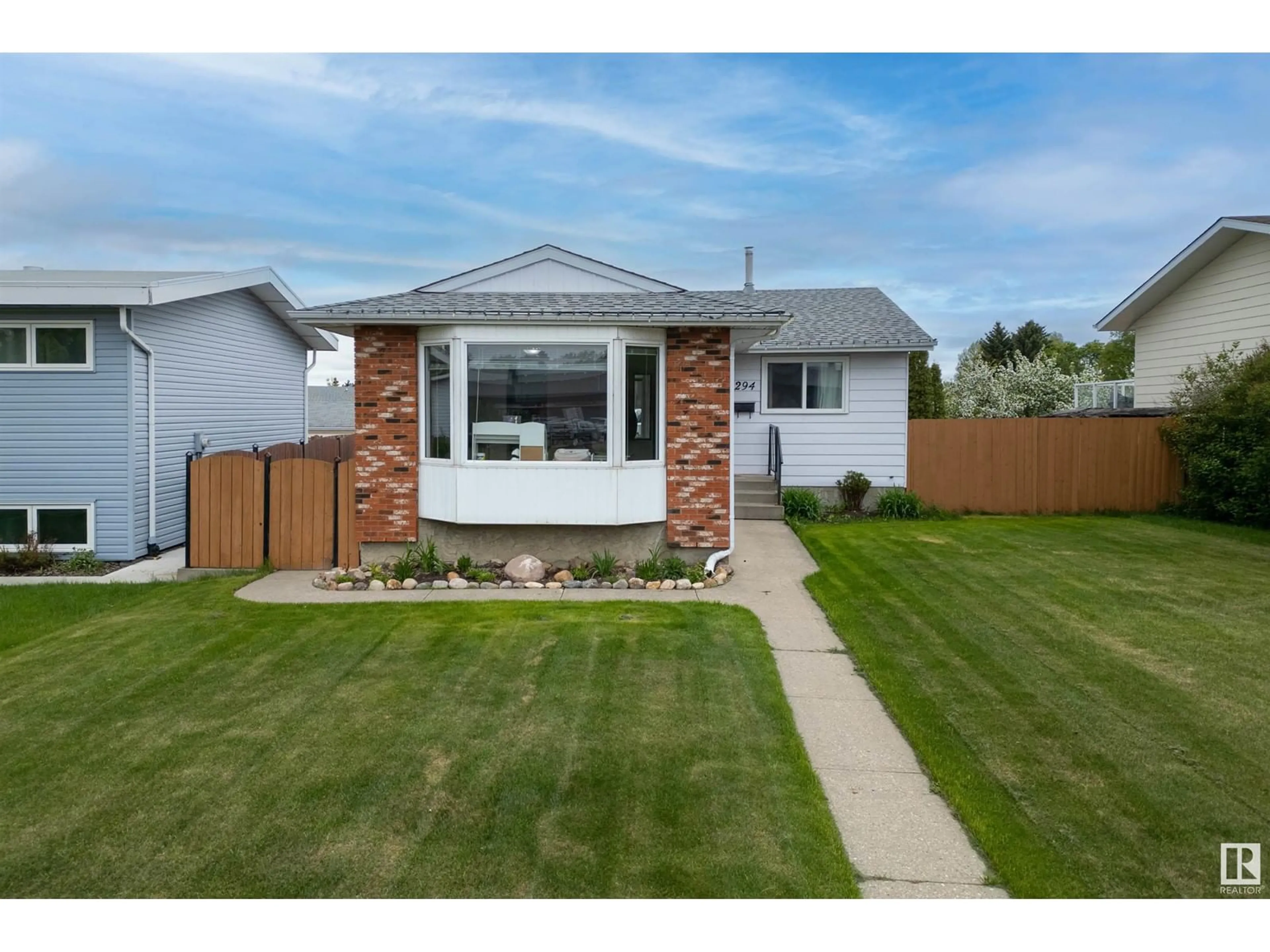 Home with vinyl exterior material, street for 294 WOODVALE RD, Edmonton Alberta T6L1P6