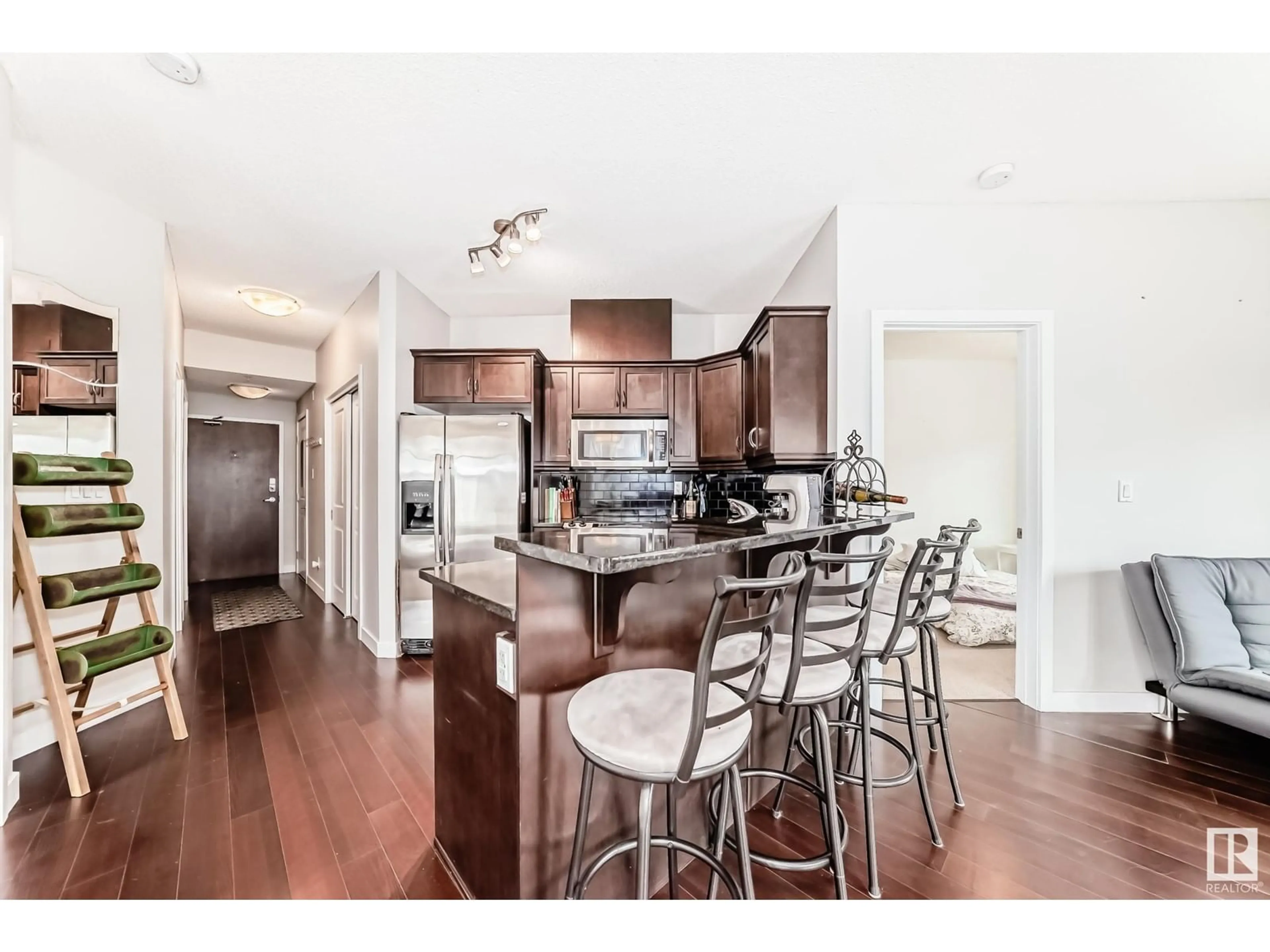 Open concept kitchen, wood/laminate floor for #102 - 7907 109 ST, Edmonton Alberta T6G1C7