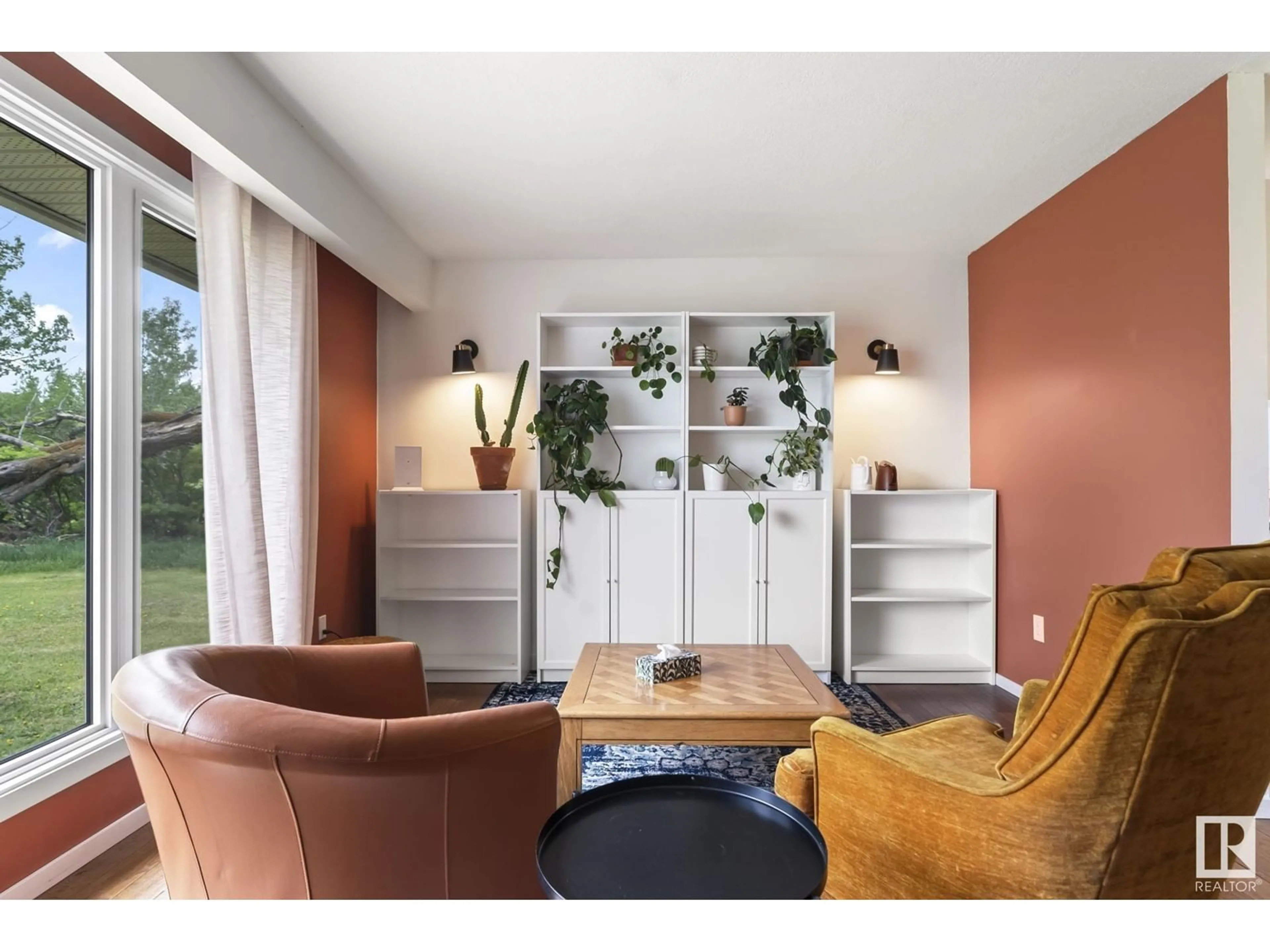 Living room with furniture, wood/laminate floor for 58018 RR 245, Rural Sturgeon County Alberta T0G1L2