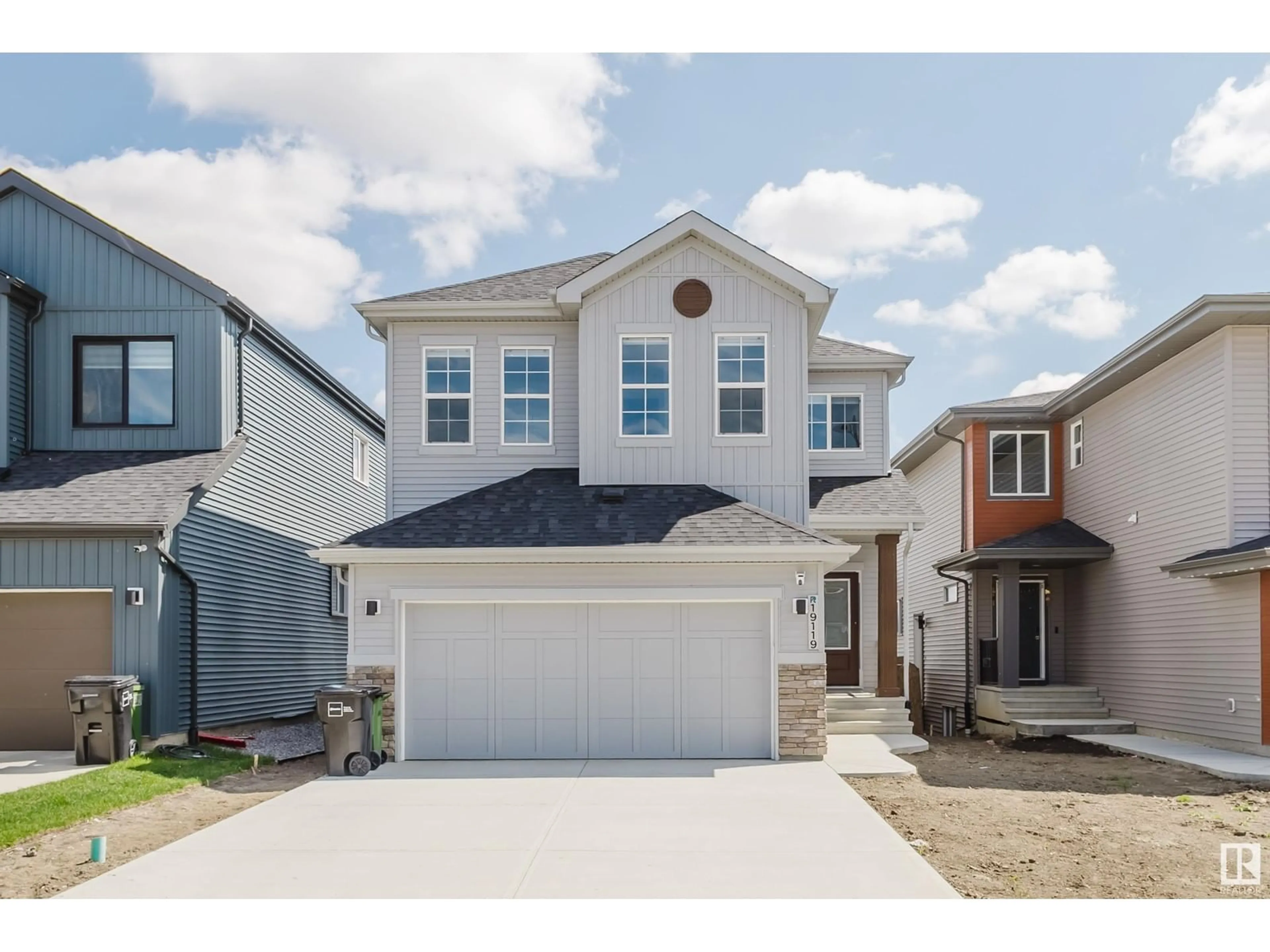 Home with vinyl exterior material, street for NW - 19119 22 AV, Edmonton Alberta T6M1R1