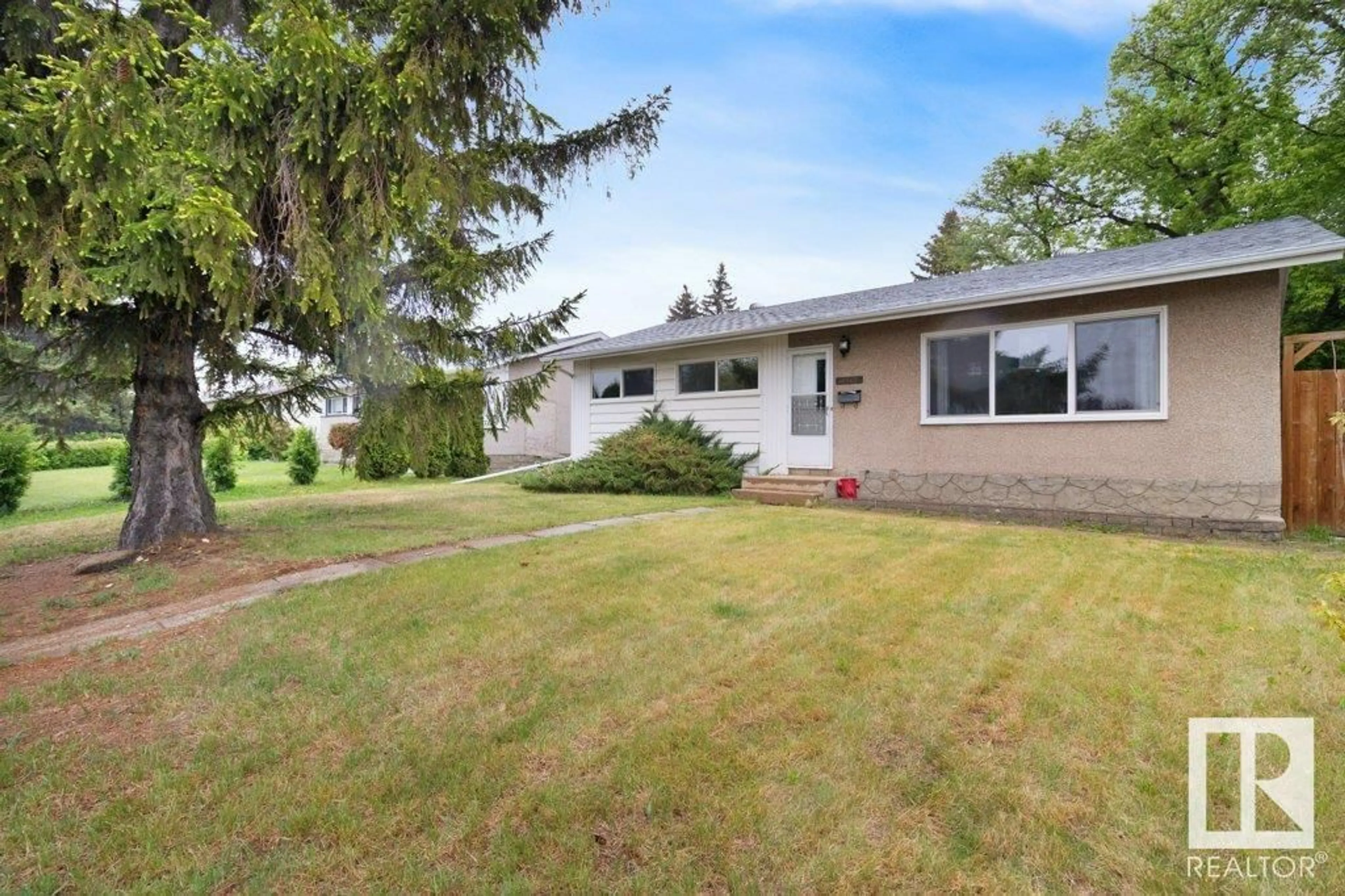 Home with vinyl exterior material, street for NW - 12908 135A AV, Edmonton Alberta T5L3Z7