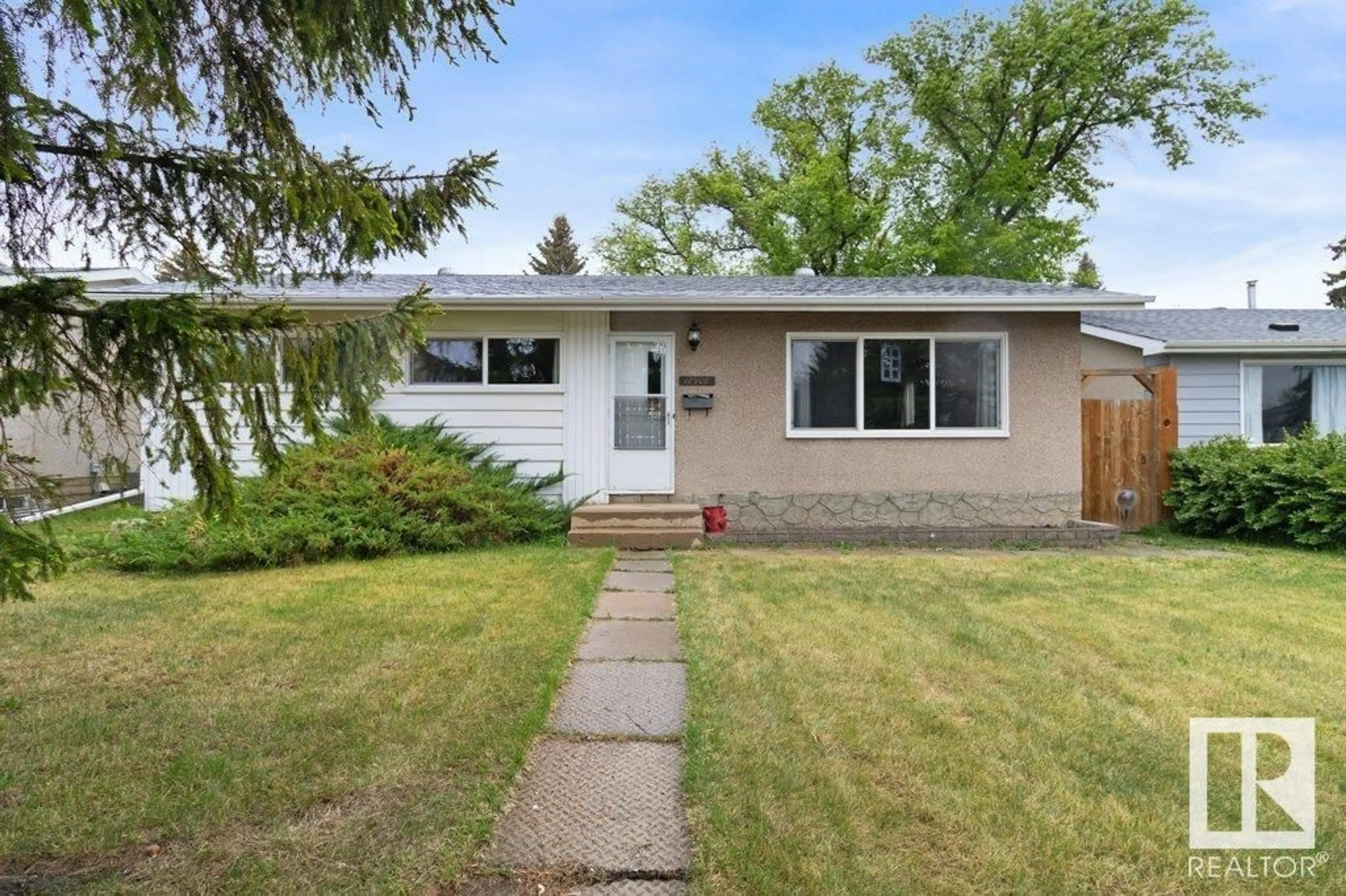 Home with vinyl exterior material, street for NW - 12908 135A AV, Edmonton Alberta T5L3Z7