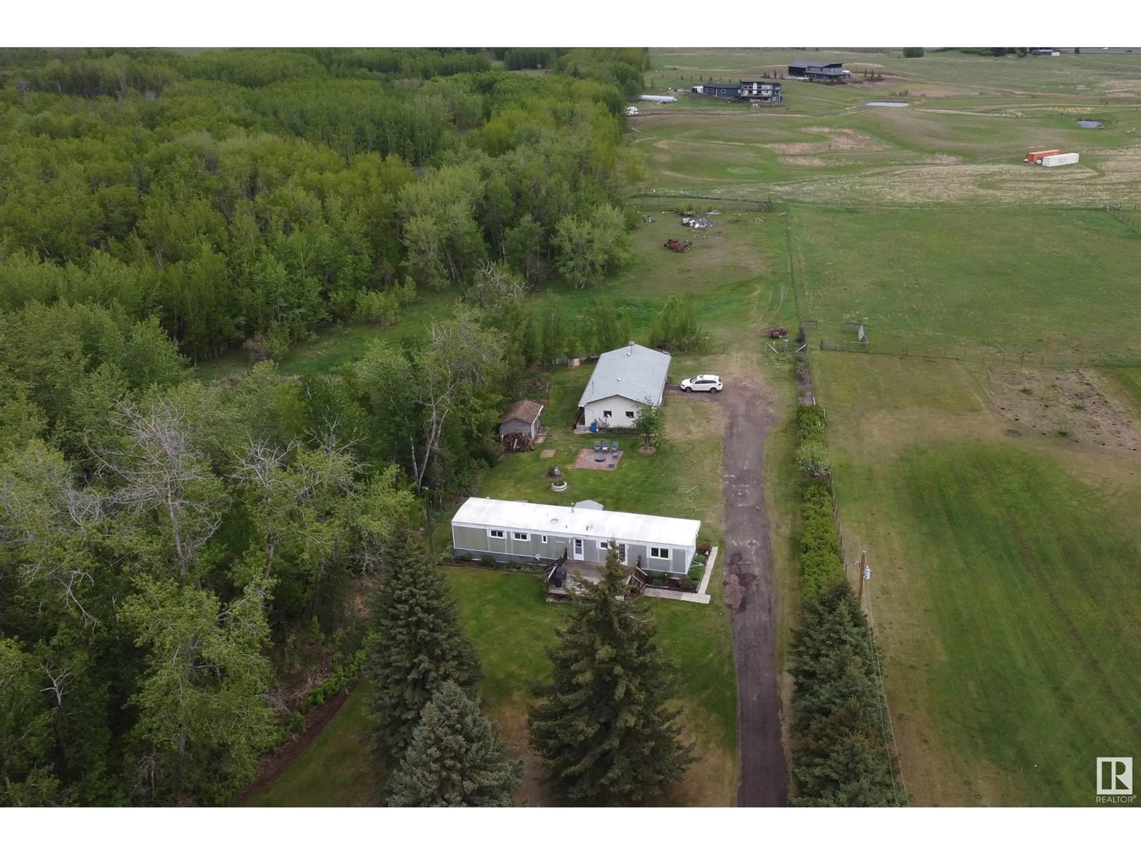 A pic from outside/outdoor area/front of a property/back of a property/a pic from drone, unknown for 169 53110 RGE ROAD 213, Rural Strathcona County Alberta T8G2C3