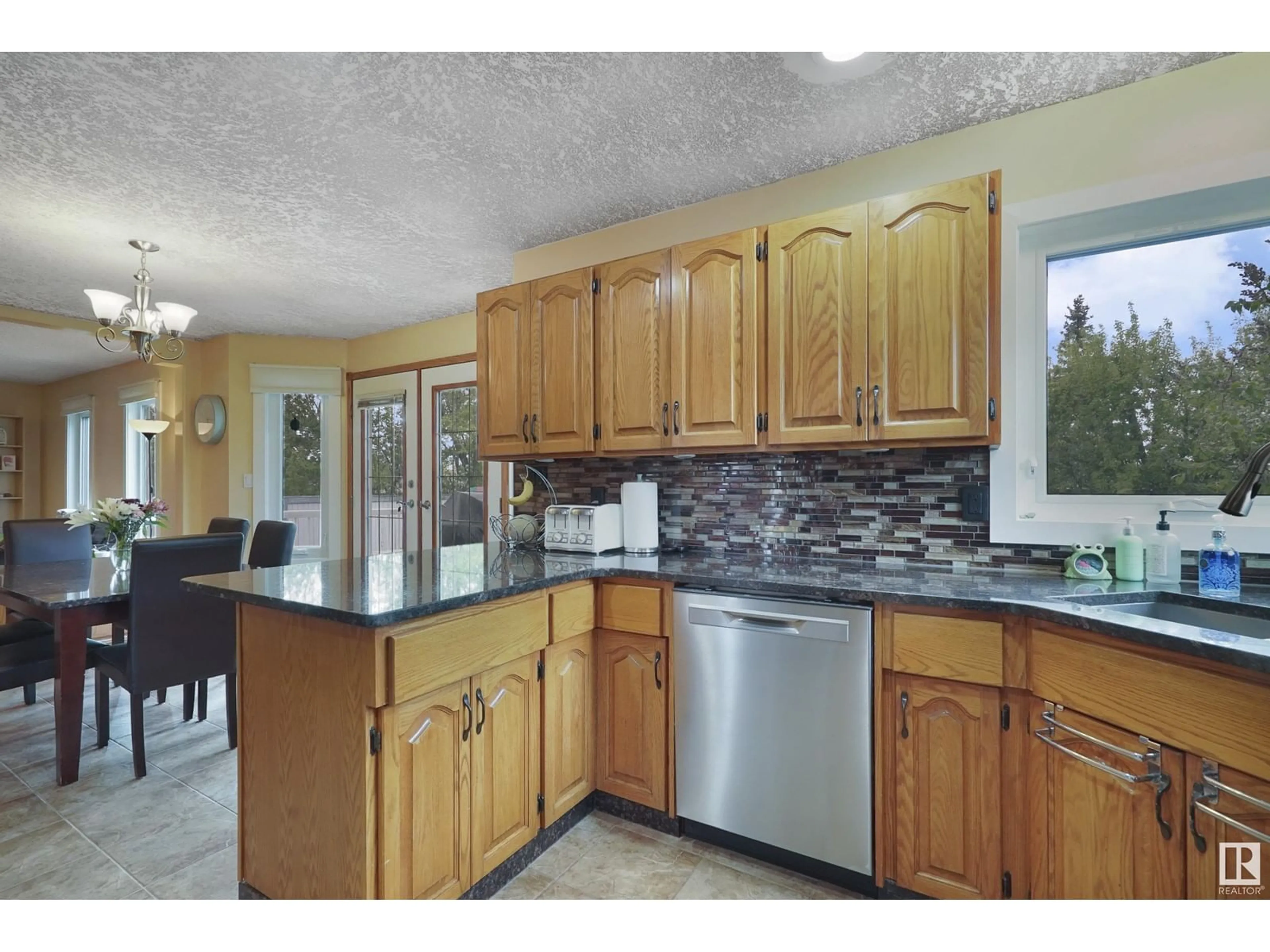 Open concept kitchen, ceramic/tile floor for 5872 159B AV, Edmonton Alberta T5Y2R5