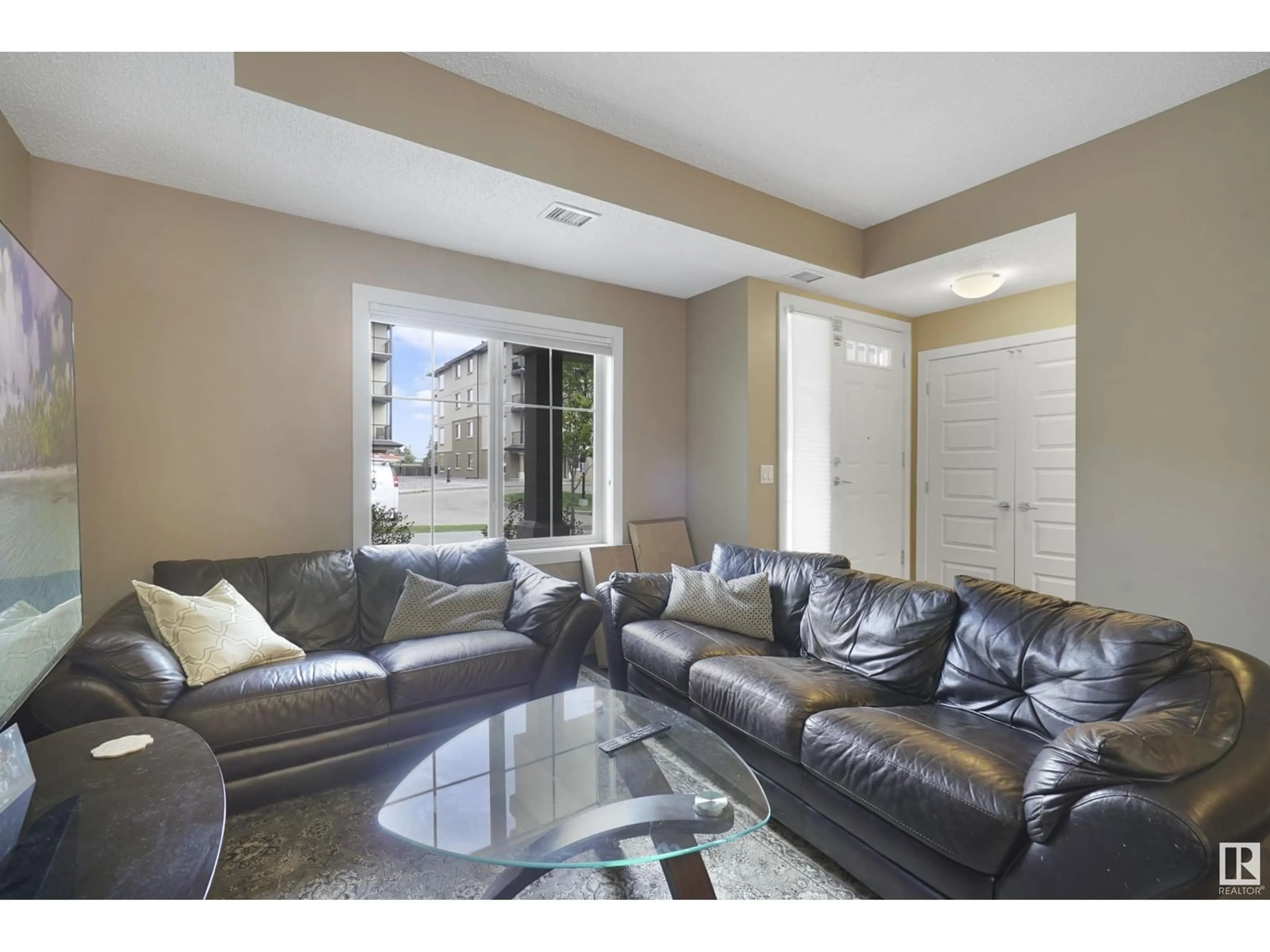 Living room with furniture, unknown for 106 - 10540 56 AV, Edmonton Alberta T6H0X7