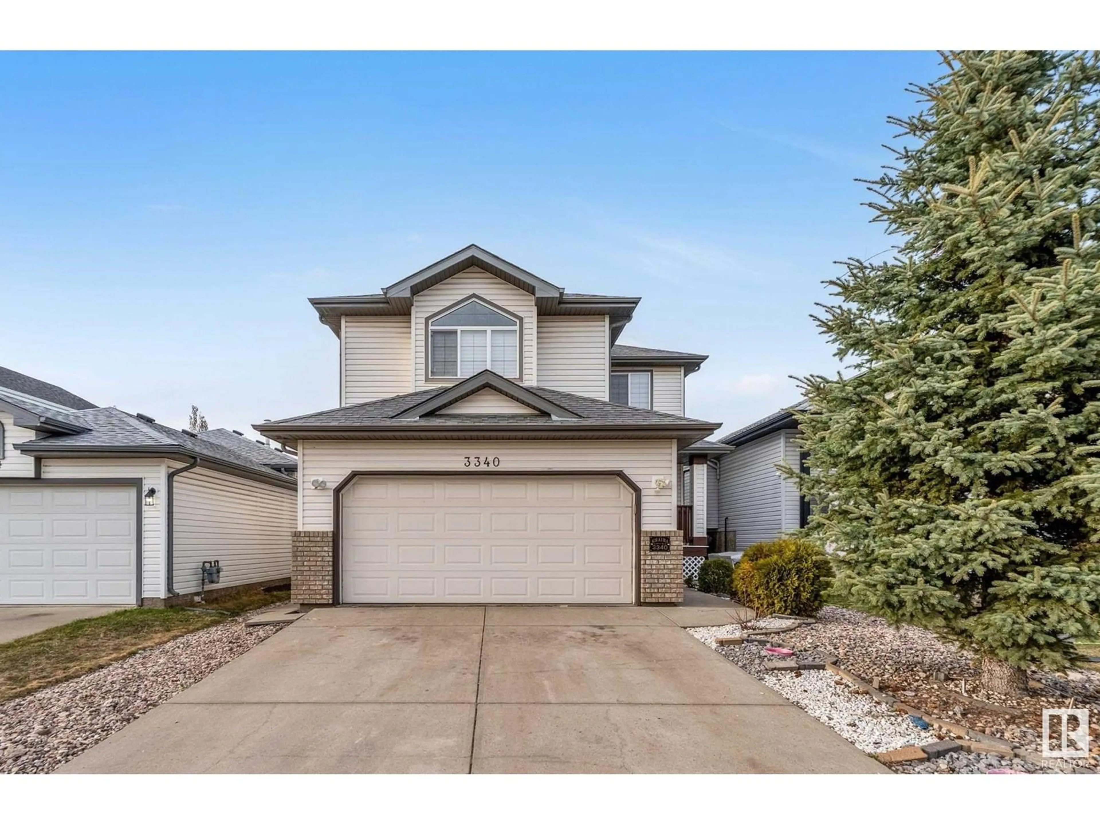 Home with vinyl exterior material, street for 3340 24 AV, Edmonton Alberta T6T1Y6