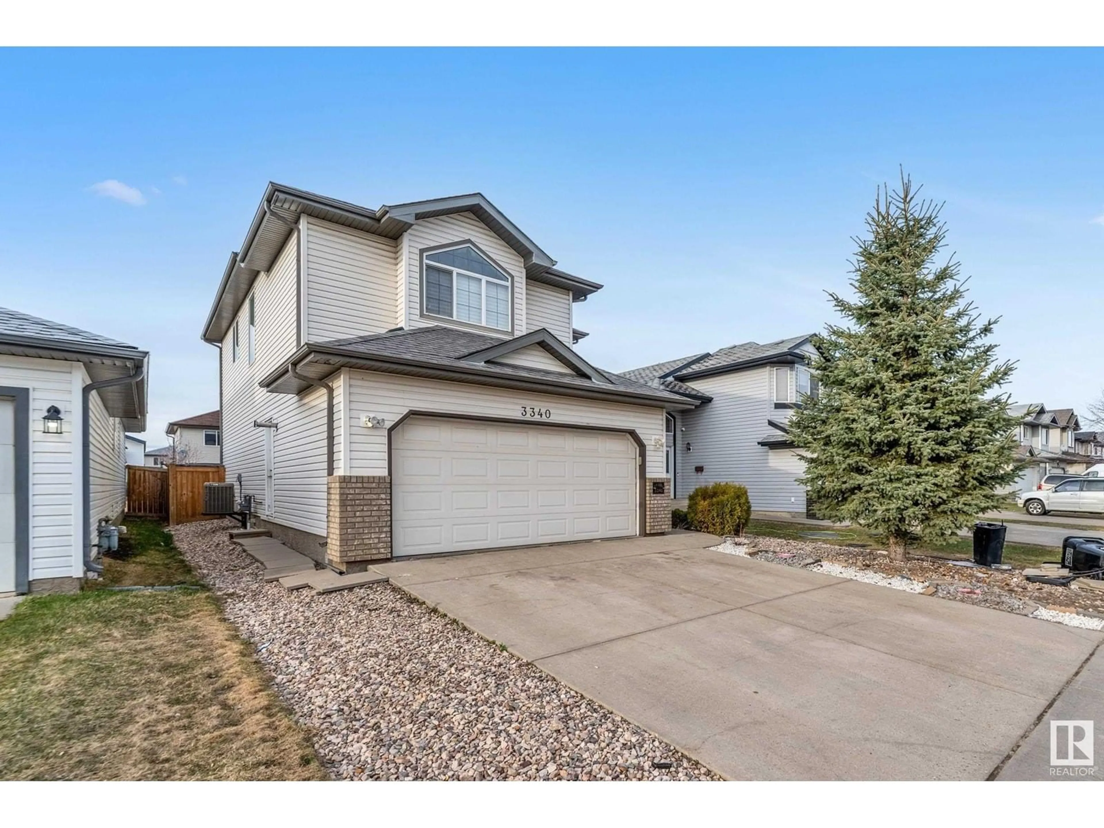 Home with vinyl exterior material, street for 3340 24 AV, Edmonton Alberta T6T1Y6