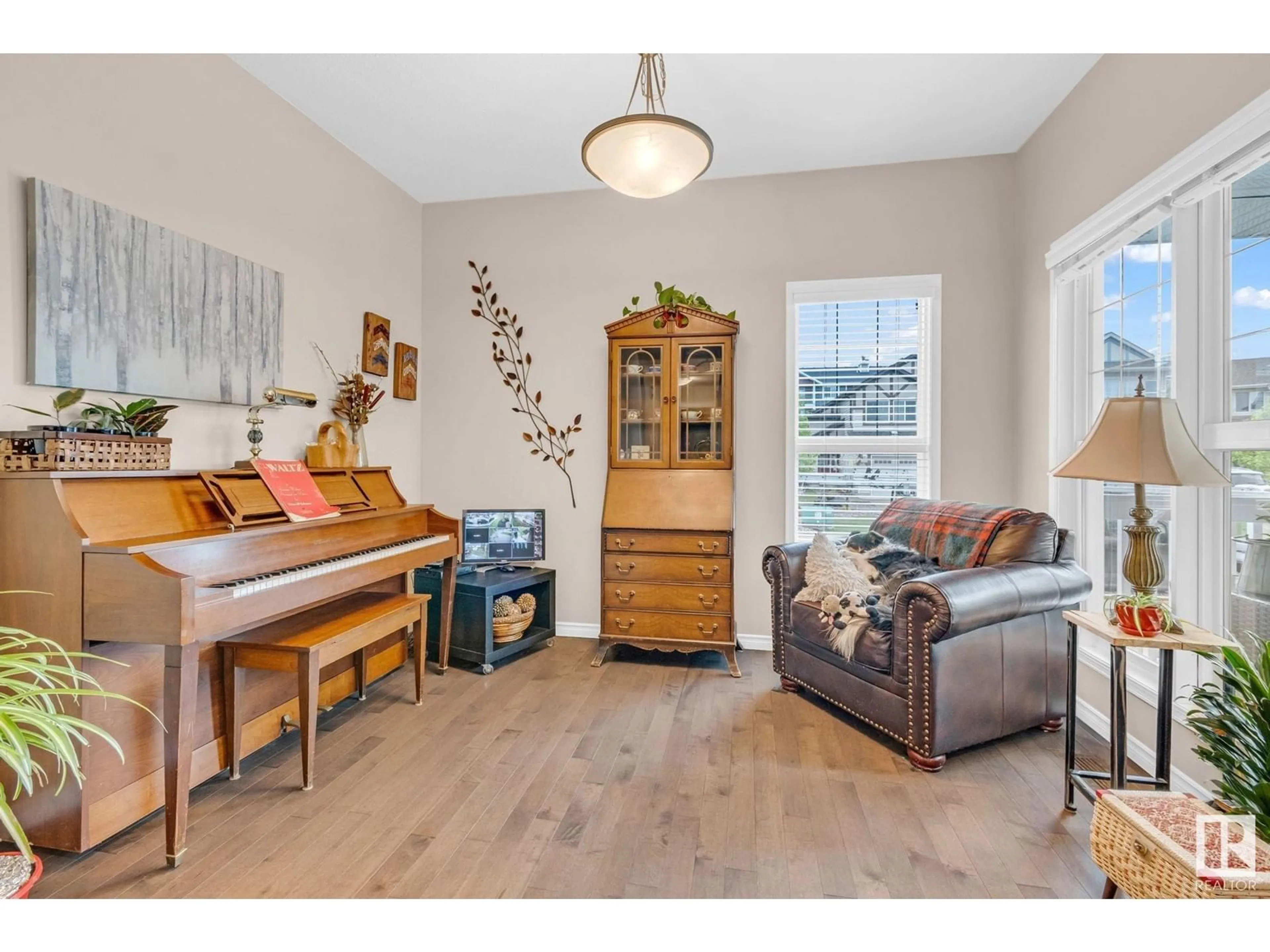 Living room with furniture, wood/laminate floor for 1426 CAREY WY, Edmonton Alberta T6W0Y8