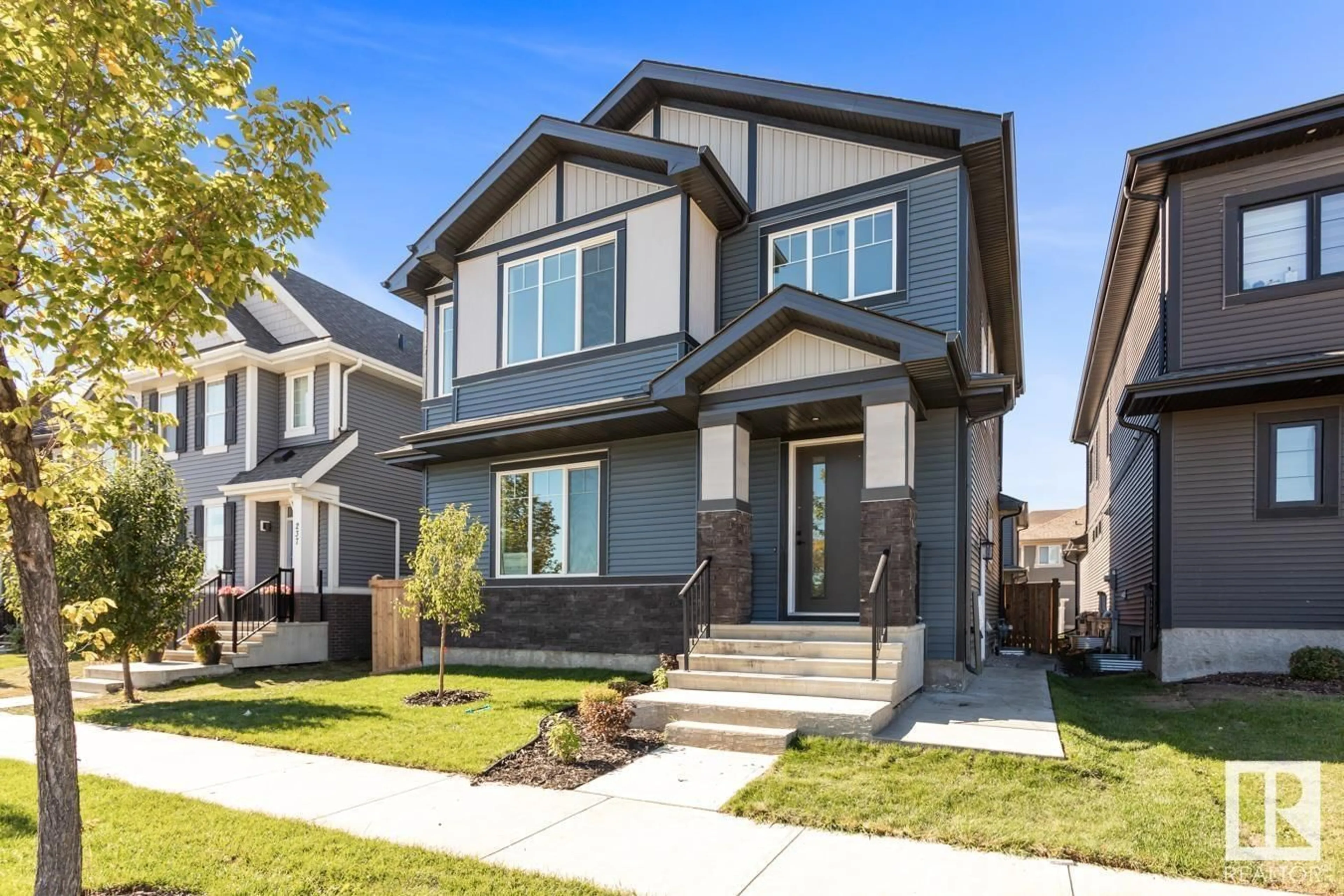 Home with vinyl exterior material, street for 239 GRIESBACH RD, Edmonton Alberta T5E6E5