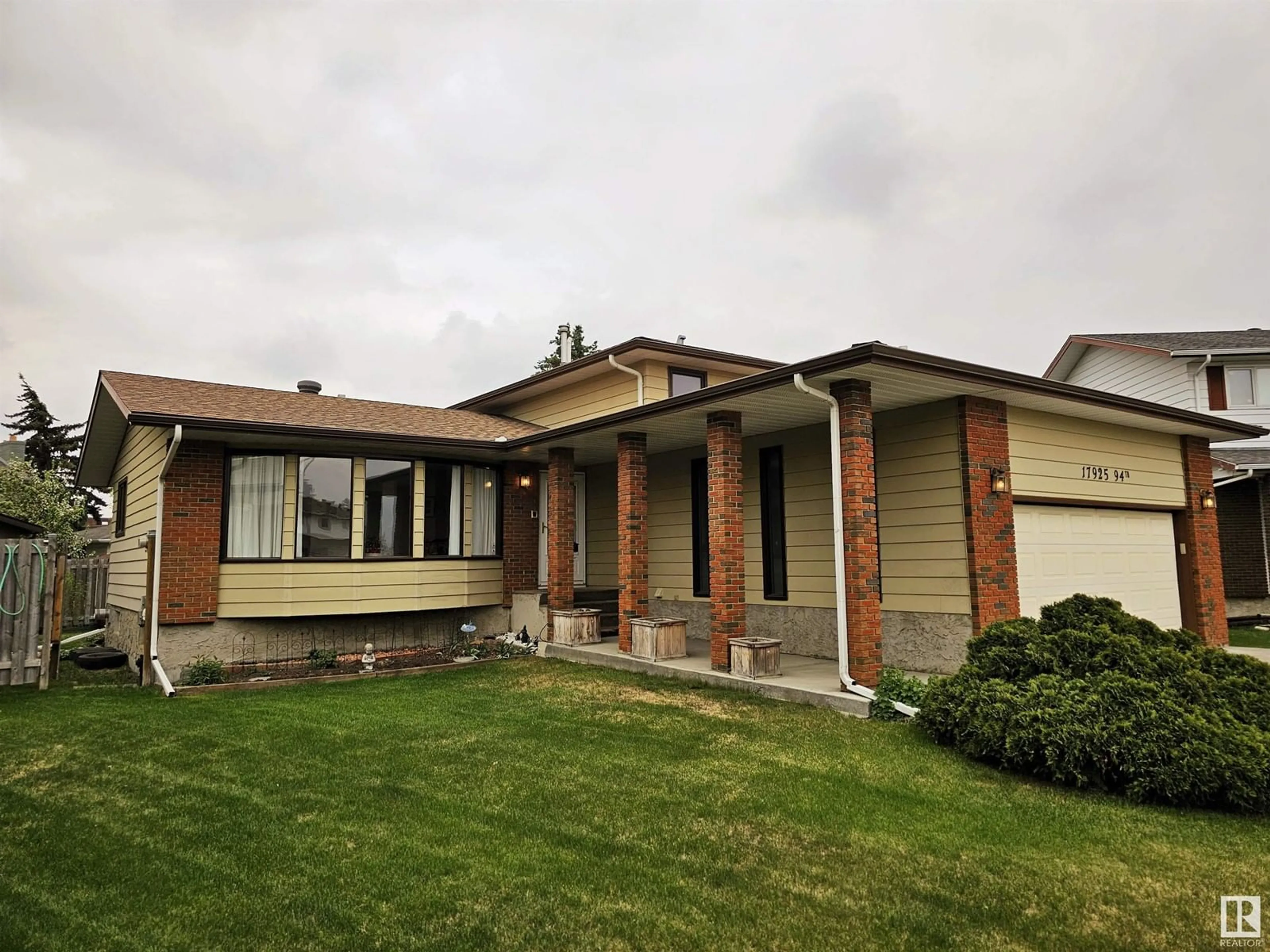 Home with vinyl exterior material, street for 17925 94 AV, Edmonton Alberta T5T1Y3