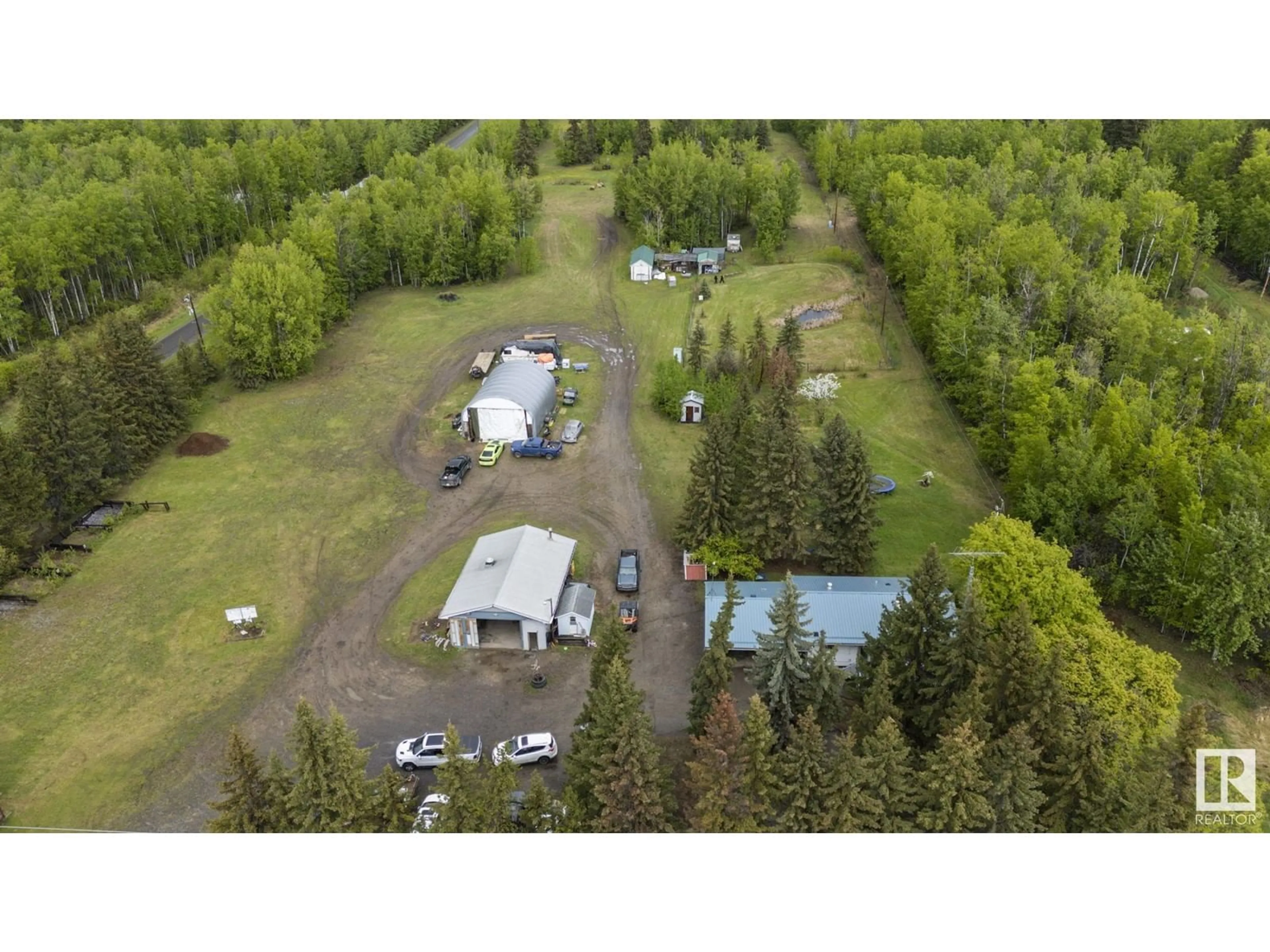 A pic from outside/outdoor area/front of a property/back of a property/a pic from drone, forest/trees view for 5432 HIGHWAY 16, Rural Parkland County Alberta T0E0W0