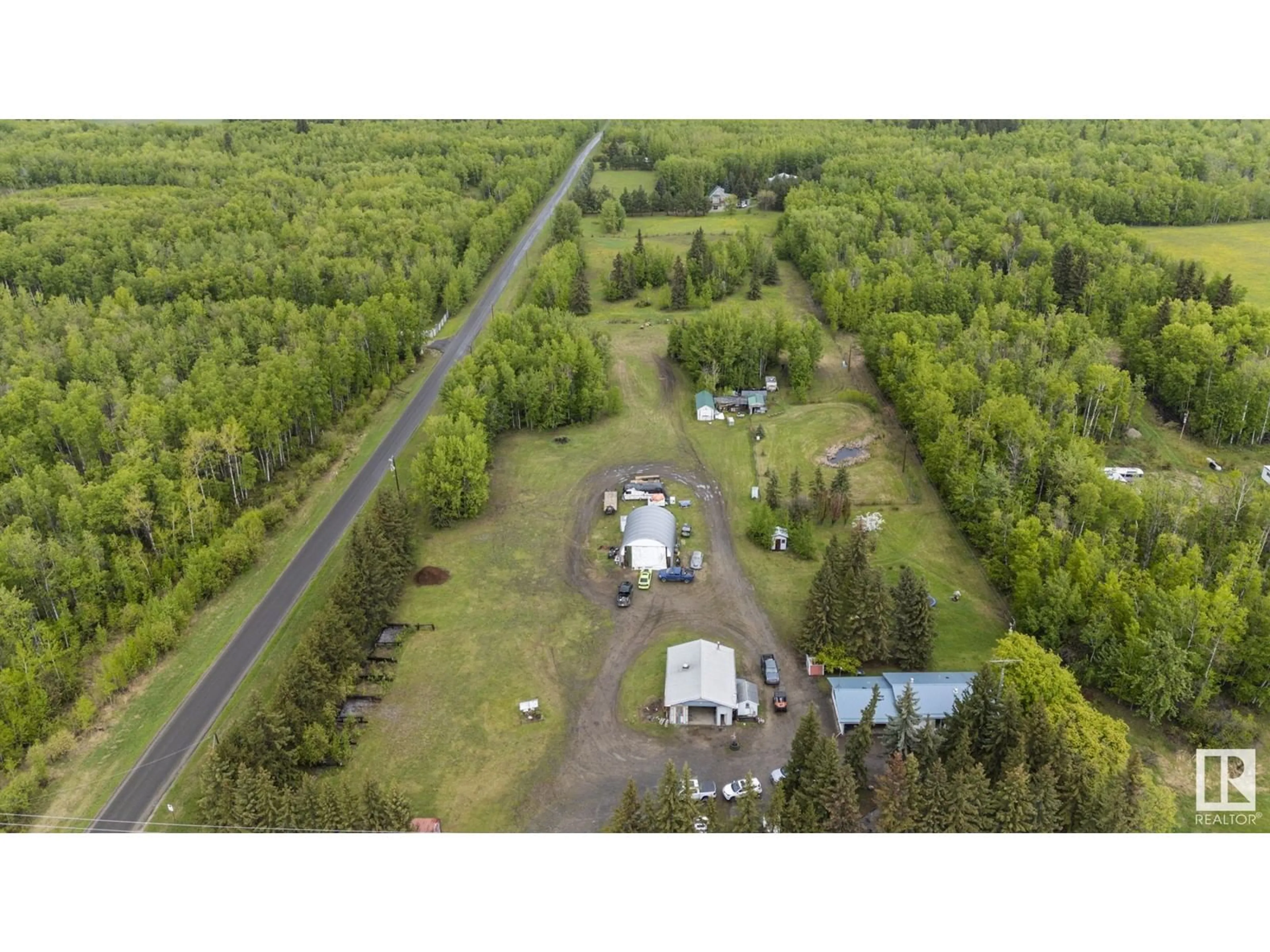 A pic from outside/outdoor area/front of a property/back of a property/a pic from drone, forest/trees view for 5432 HIGHWAY 16, Rural Parkland County Alberta T0E0W0