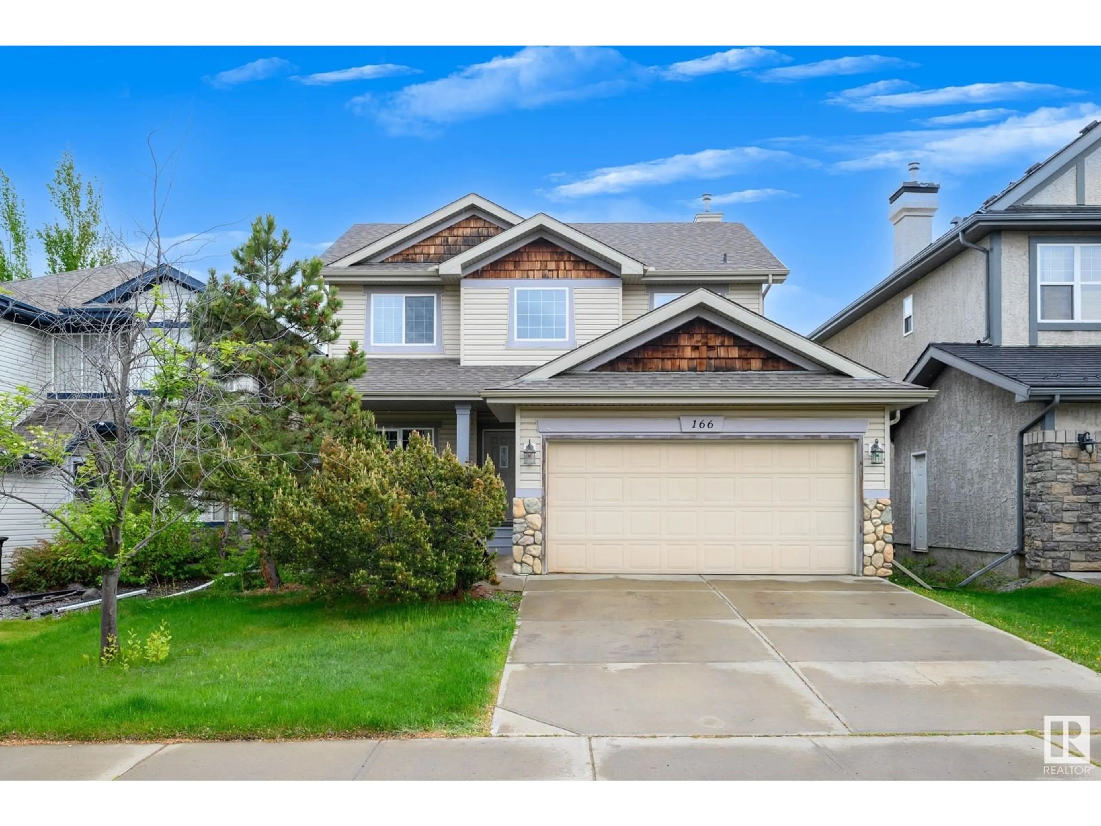 Home with vinyl exterior material, street for 166 HAYWARD CR, Edmonton Alberta T6R3G2