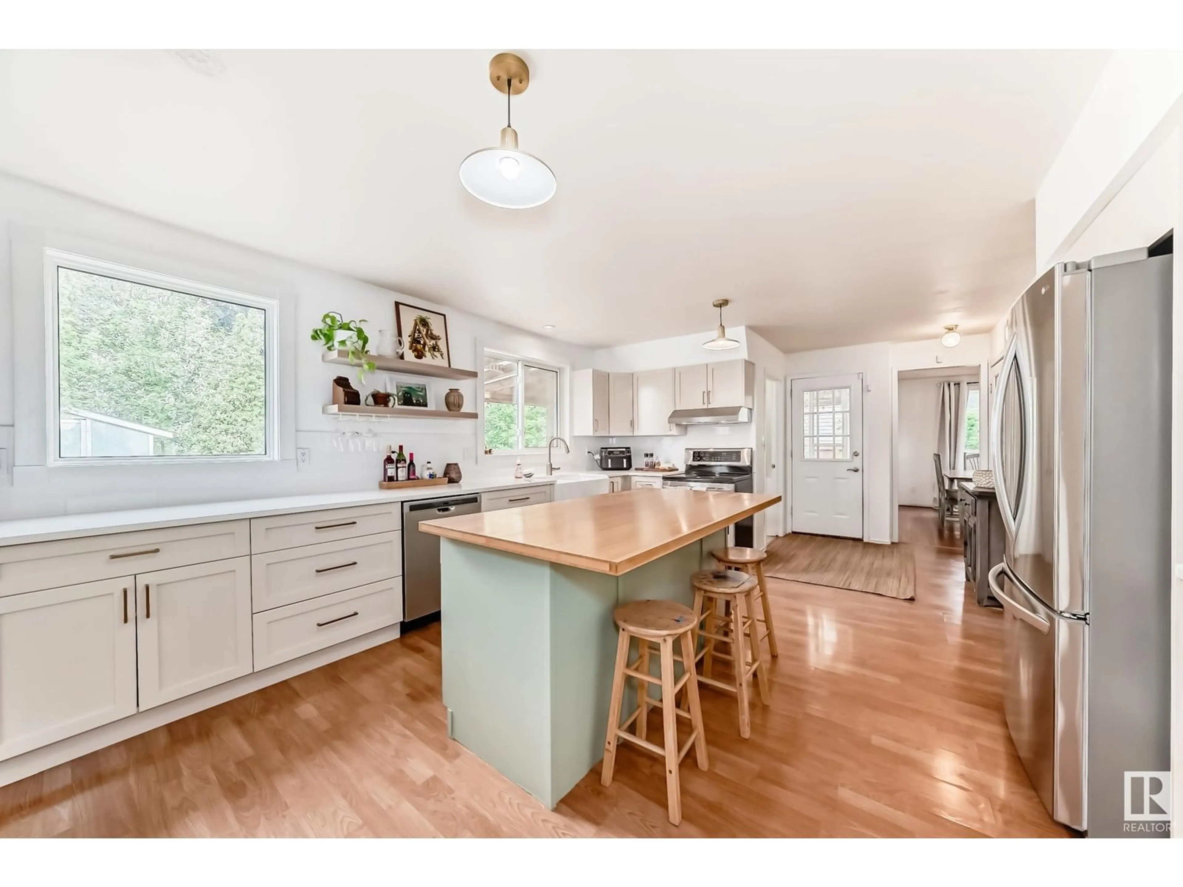 Open concept kitchen, wood/laminate floor for NW - 13823 23 ST, Edmonton Alberta T5Y1C1