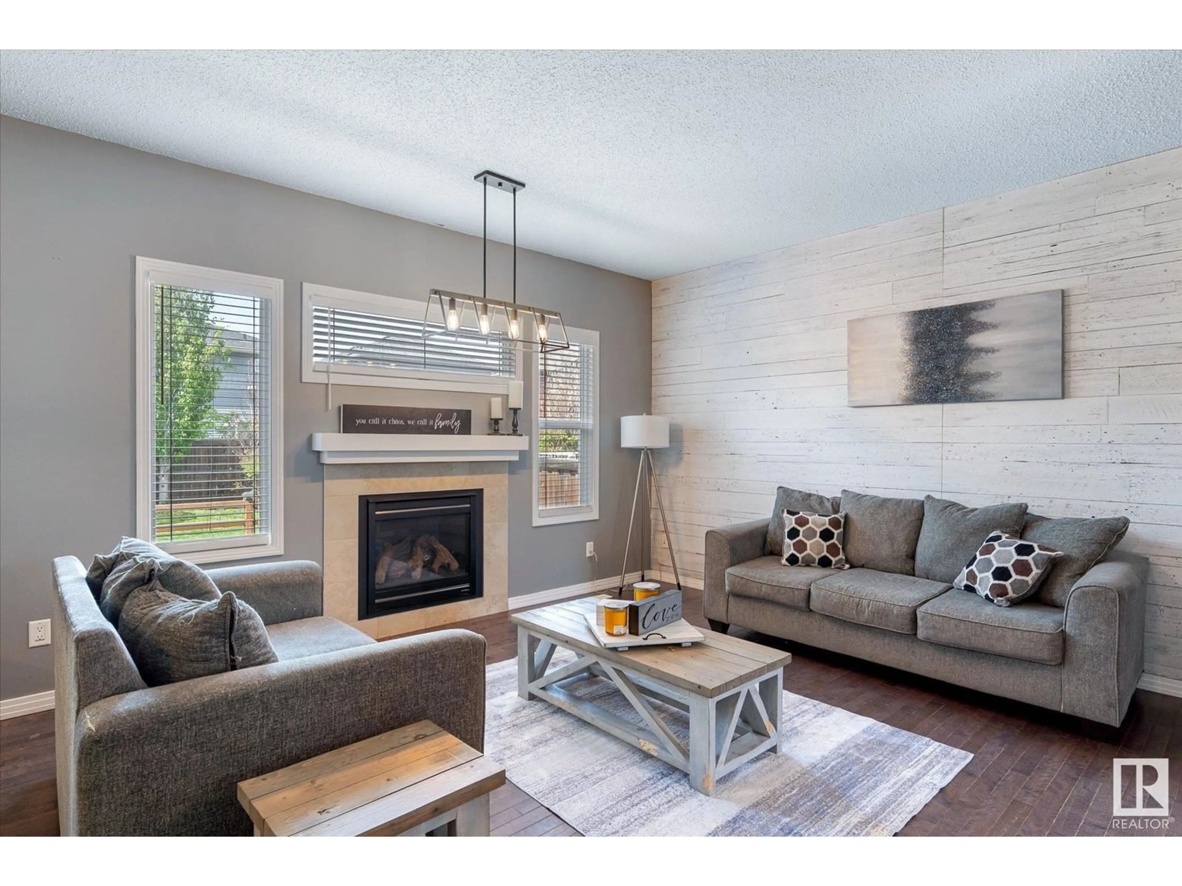 Living room with furniture, wood/laminate floor for NW - 17112 80 ST, Edmonton Alberta T5Z0E2