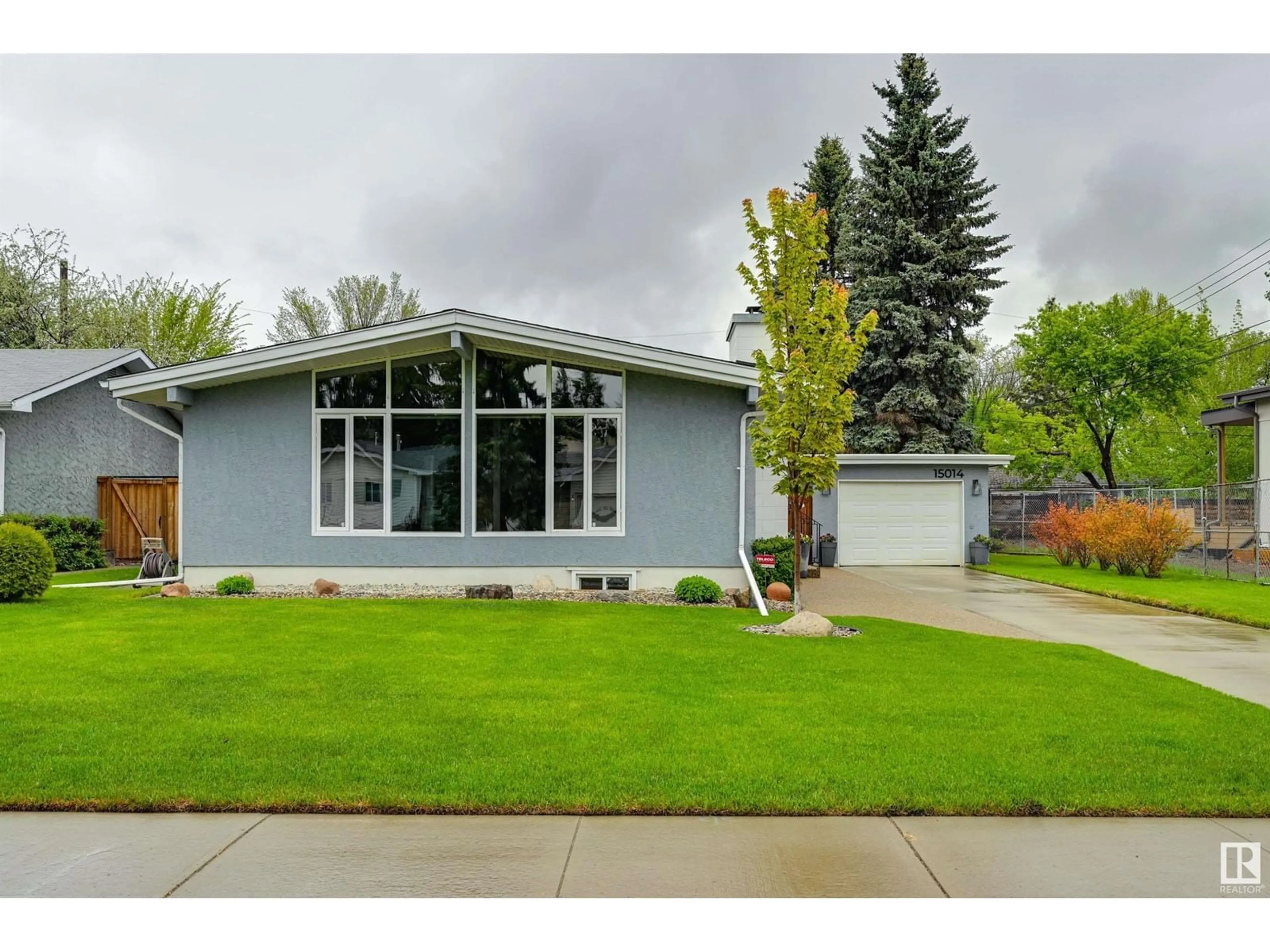 Home with vinyl exterior material, street for 15014 75 AV, Edmonton Alberta T5R2Y7
